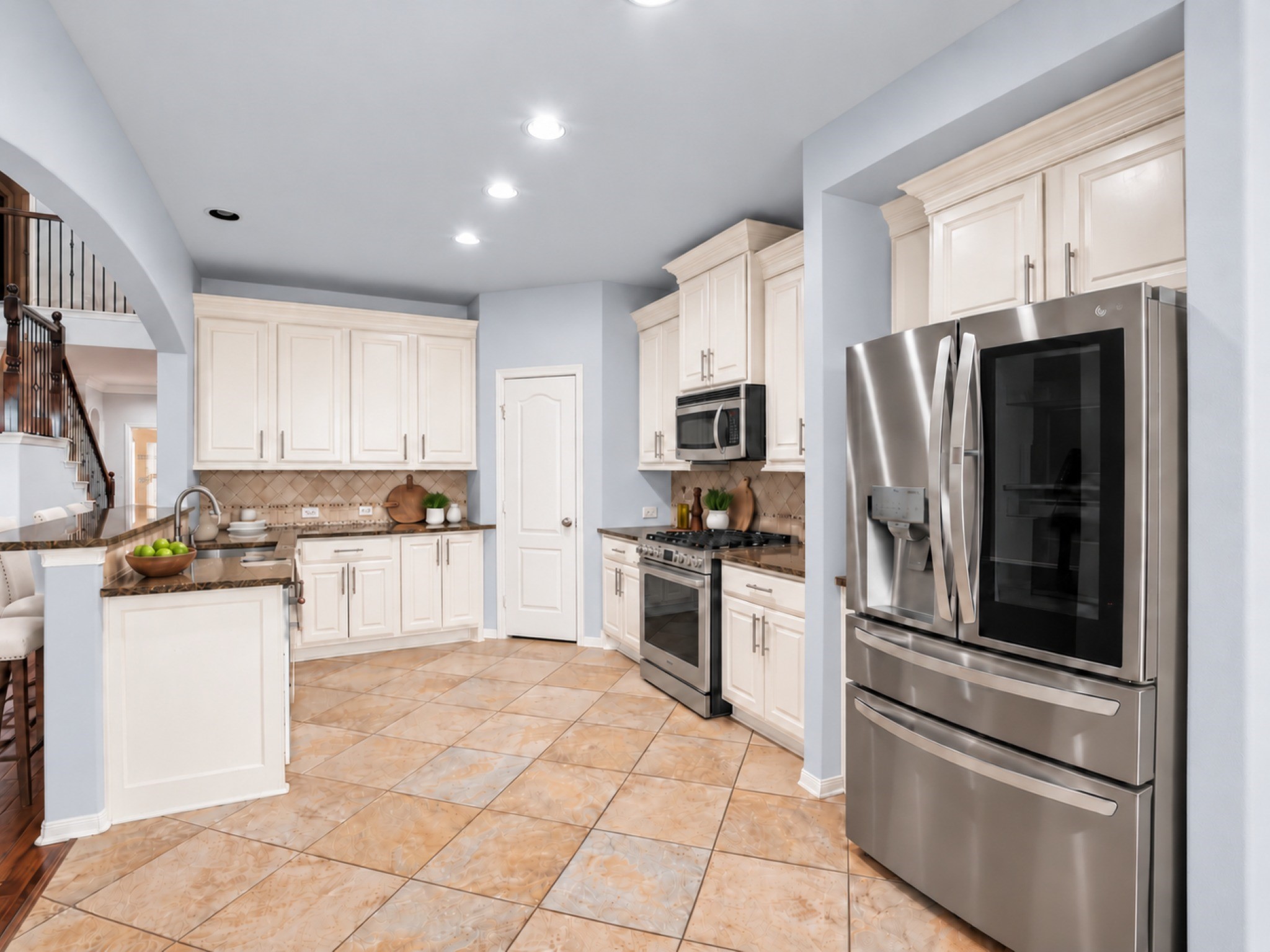 Plenty of cabinet and counter space here with SS appliances!