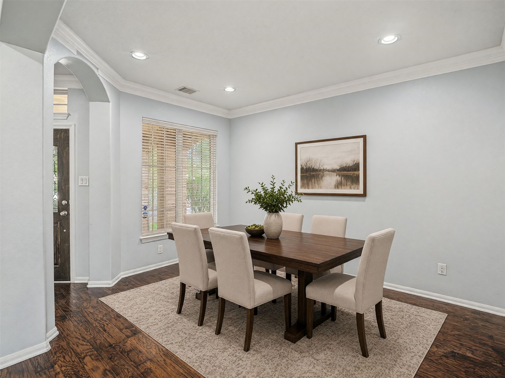 Virtually staged dining room, just off the foyer.