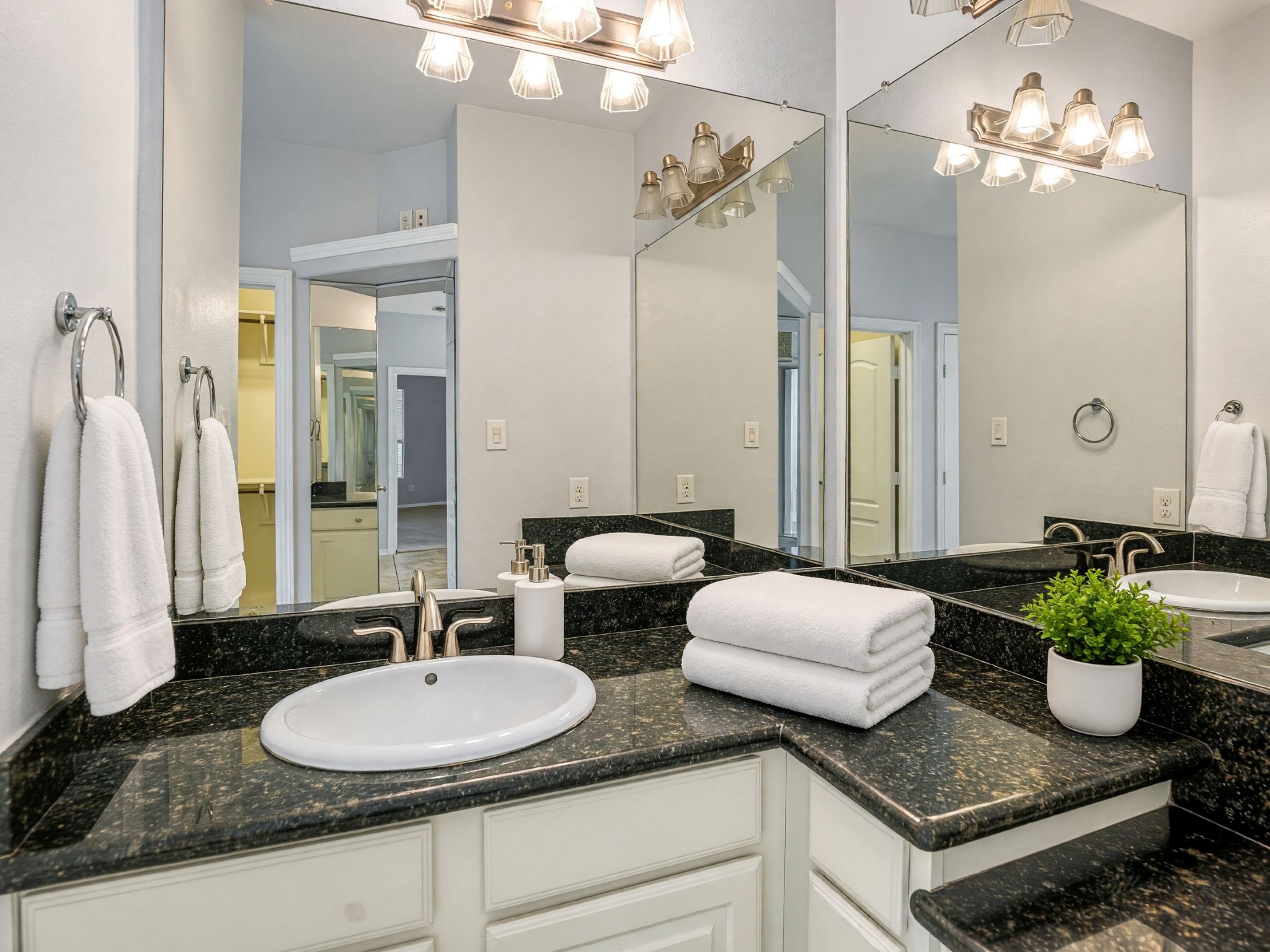 Primary bath -mirrors get the angles! Vanity to sit at to get ready for the day!