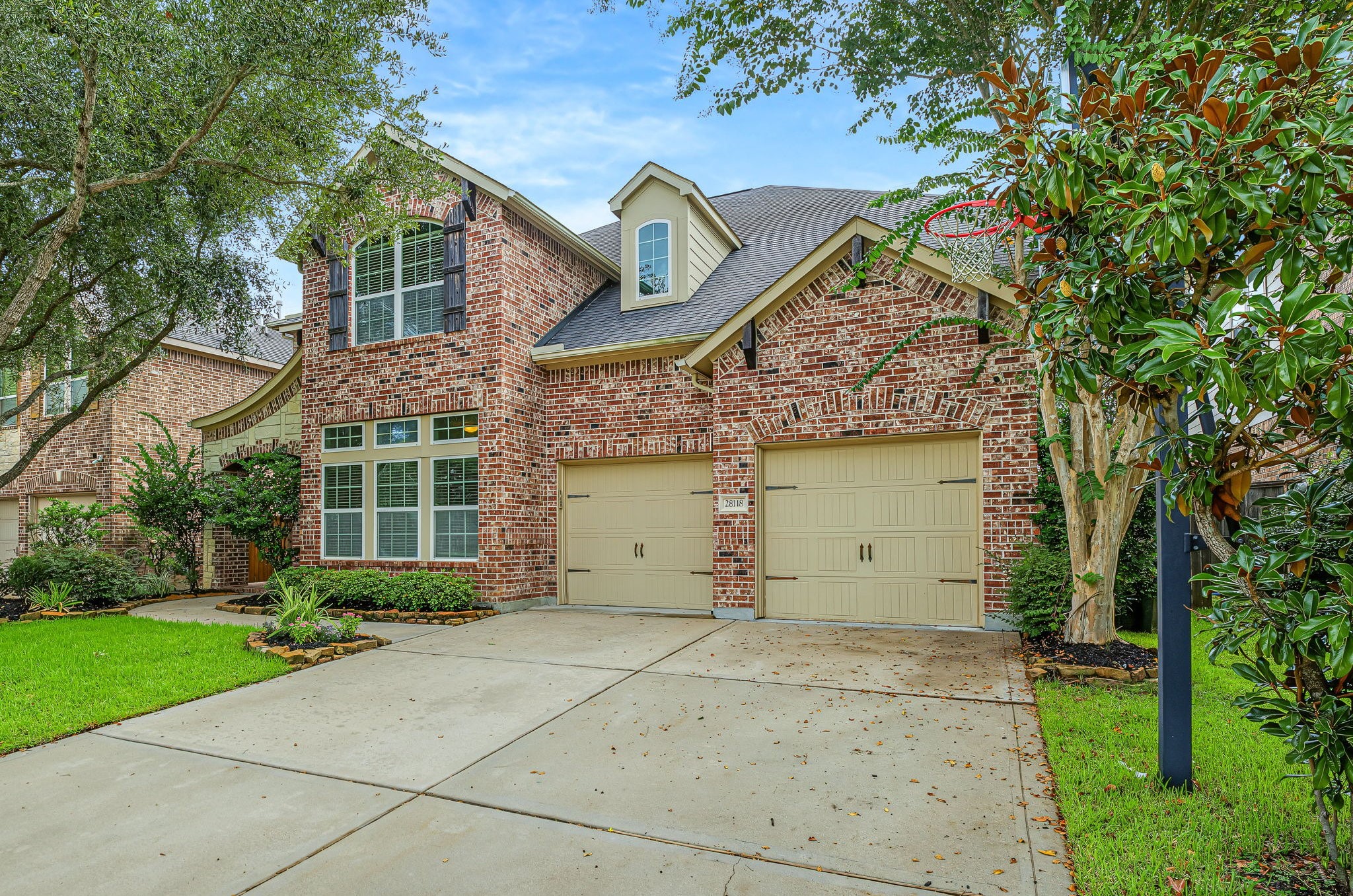 Sharp elevation, you'll never tire of! Love the decorative garage doors!