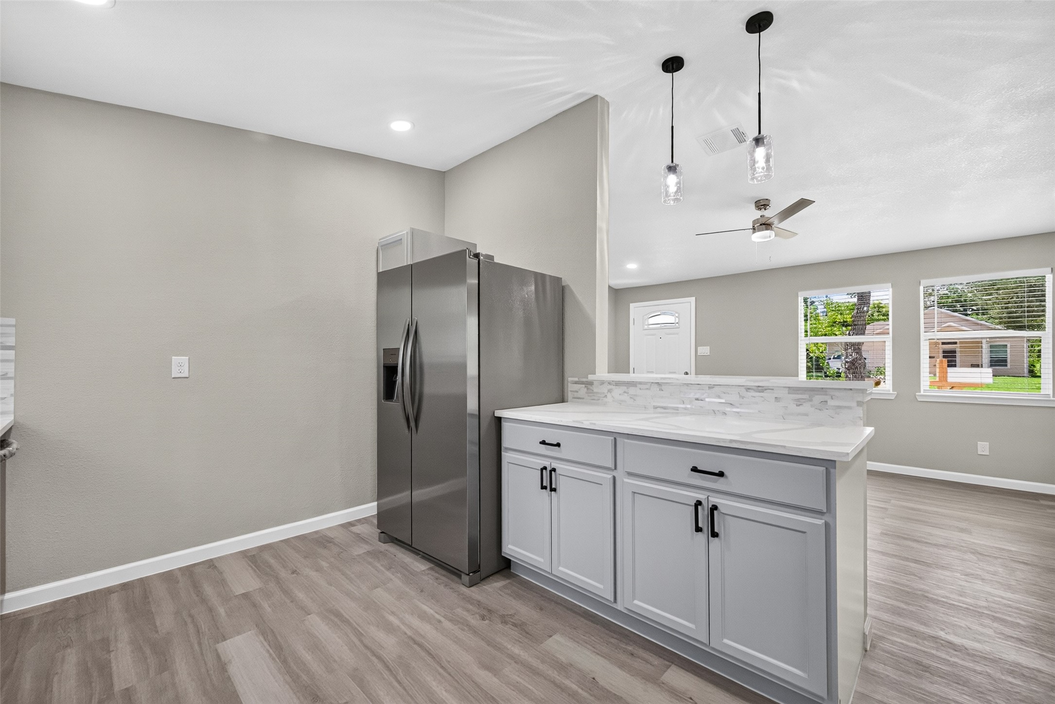 Pendant lights above bar top in kitchen