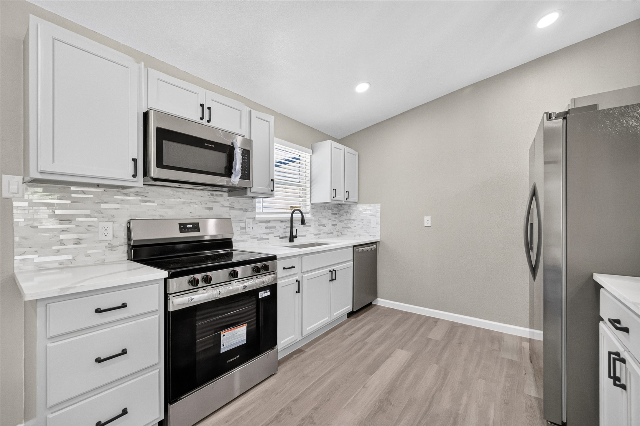 View of kitchen with stainless steel appliances included