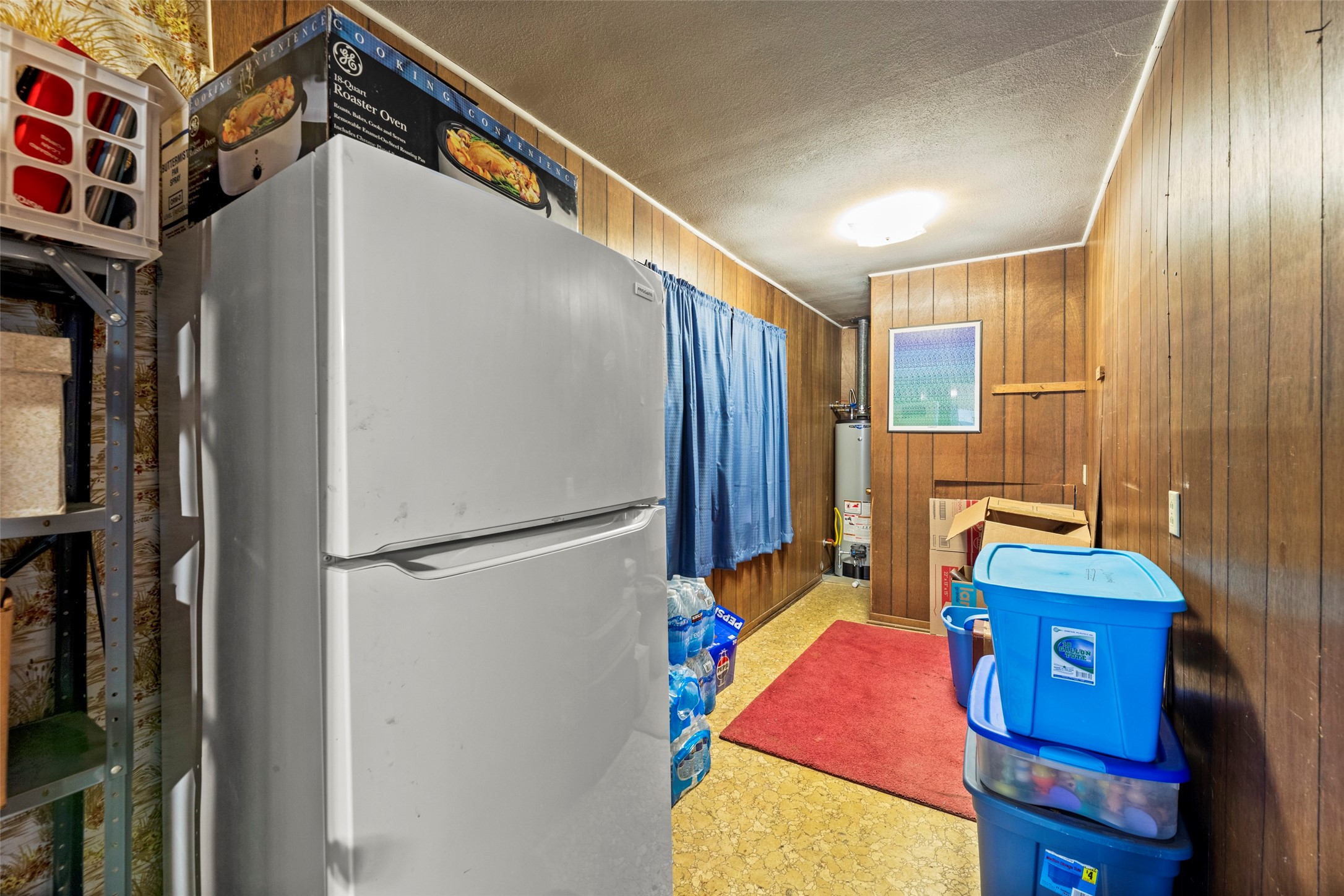 Storage area off kitchen that also leads to garage entry