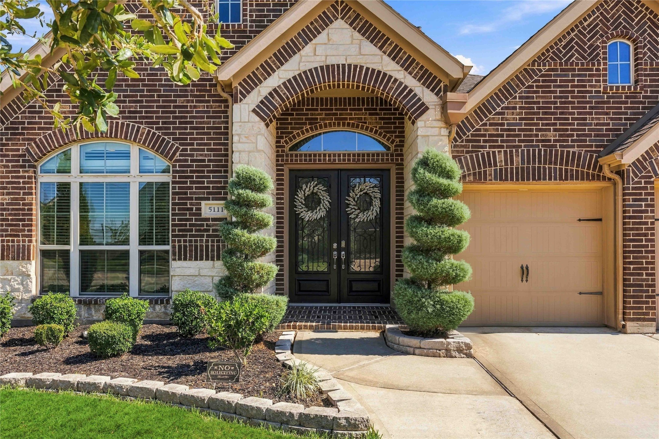 Beautiful home featuring manicured landscaping , a spacious driveway, and a two car garage. Beautiful home featuring manicured landscaping , a spacious driveway, and a two car garage.