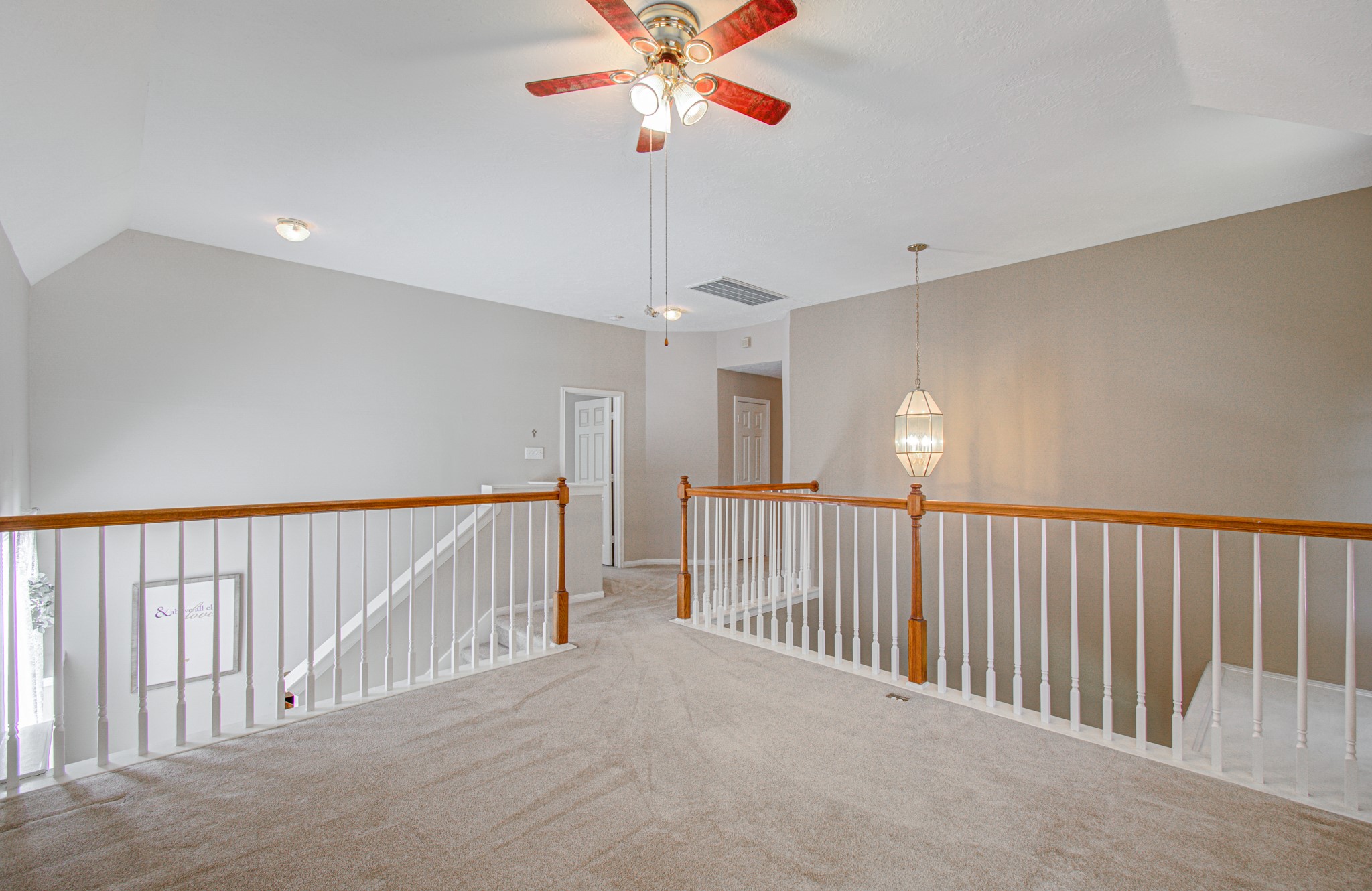 Spacious upstairs game room provides a flexible gathering space for movie nights, games or simply relaxing, with an open view overlooking the downstairs foyer.