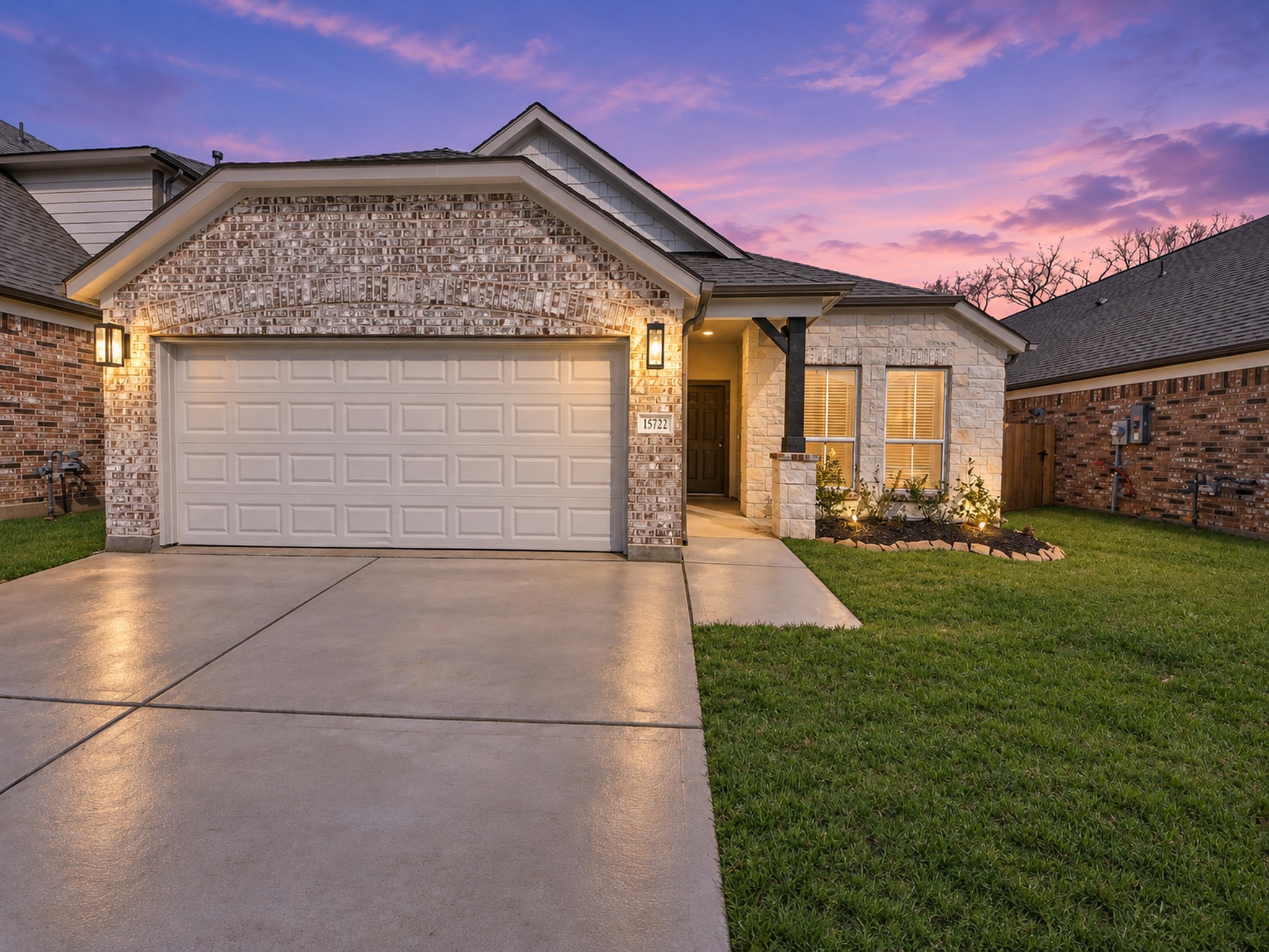 Experience the charm of this beautifully illuminated home, showcasing its inviting front elevation against a serene virtual twilight backdrop. Experience the charm of this beautifully illuminated home, showcasing its inviting front elevation against a serene virtual twilight backdrop.