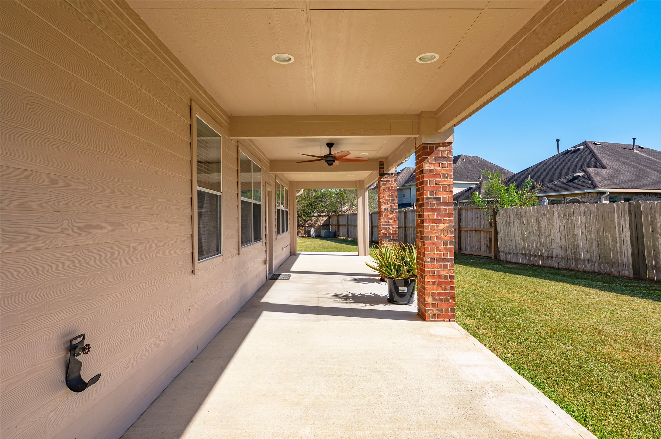 Enjoy grilling, dining and relaxing outdoors in the shade of the covered patio.