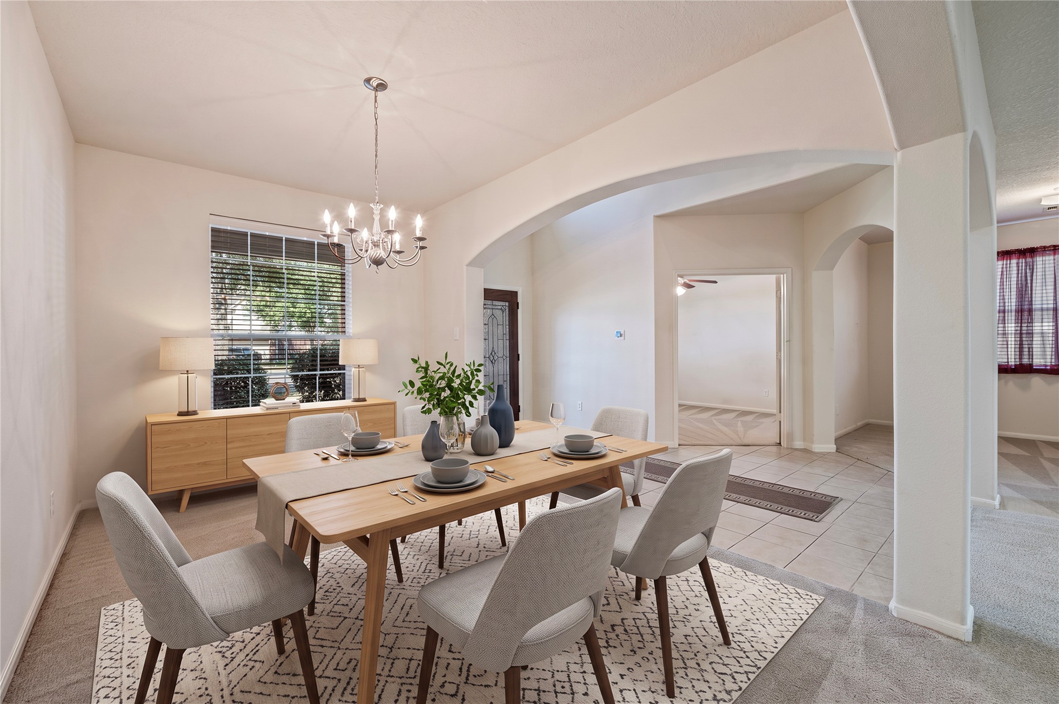 The formal dining room at the front of the home offers plenty of space for holiday dinners and entertaining. Room is virtually staged.