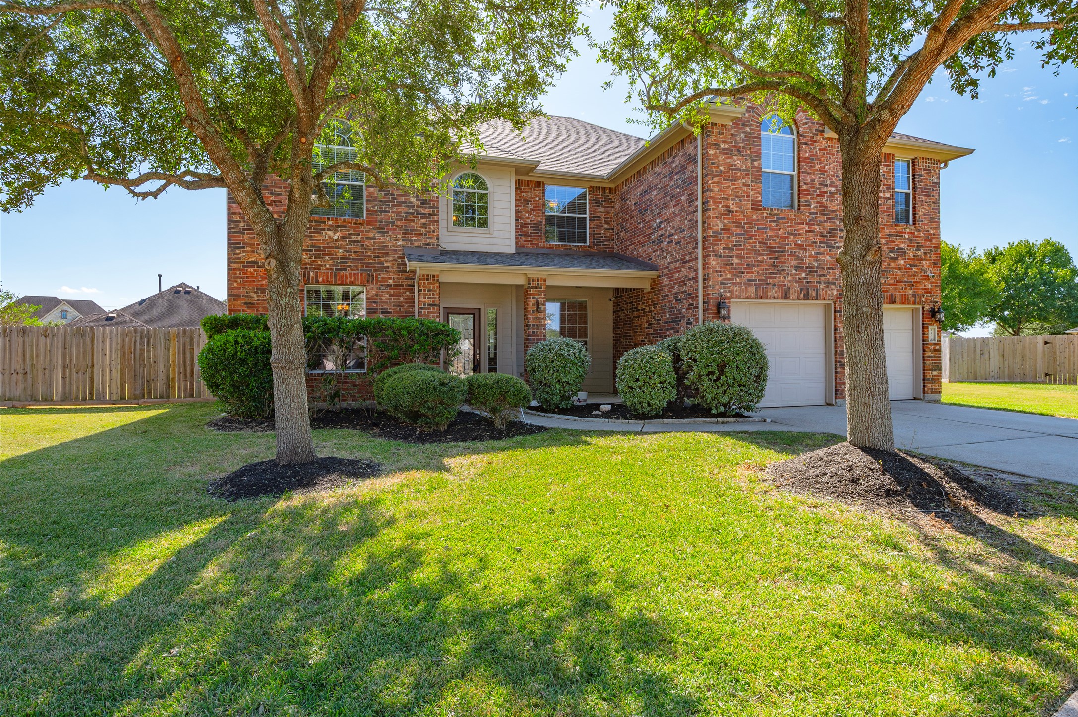 A wide, deep front yard sets the home back from the street for extra privacy and a striking first impression. A wide, deep front yard sets the home back from the street for extra privacy and a striking first impression.
