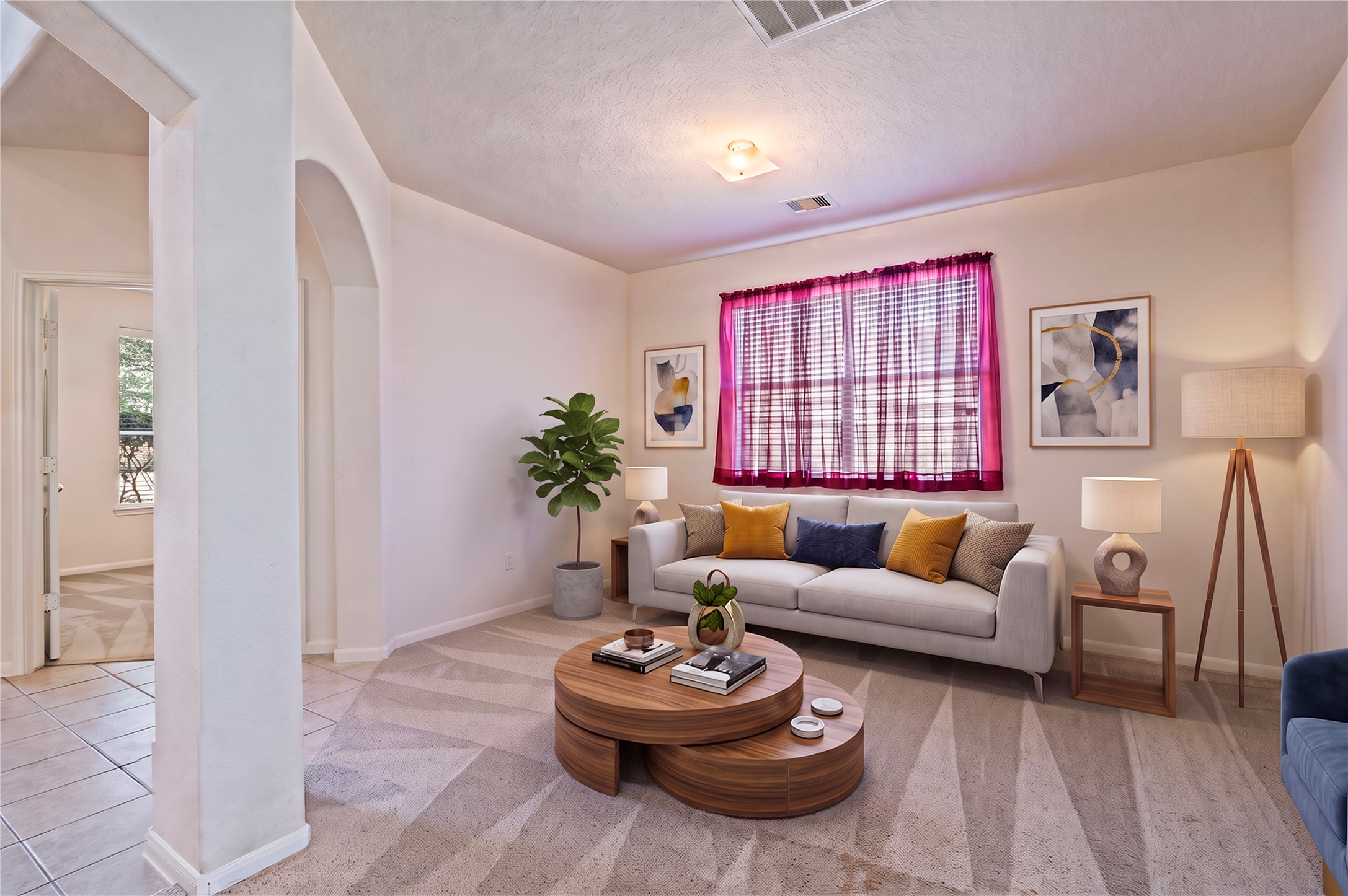 The formal living room offers a second gathering space, with arched openings and large front windows. Room is virtually staged.