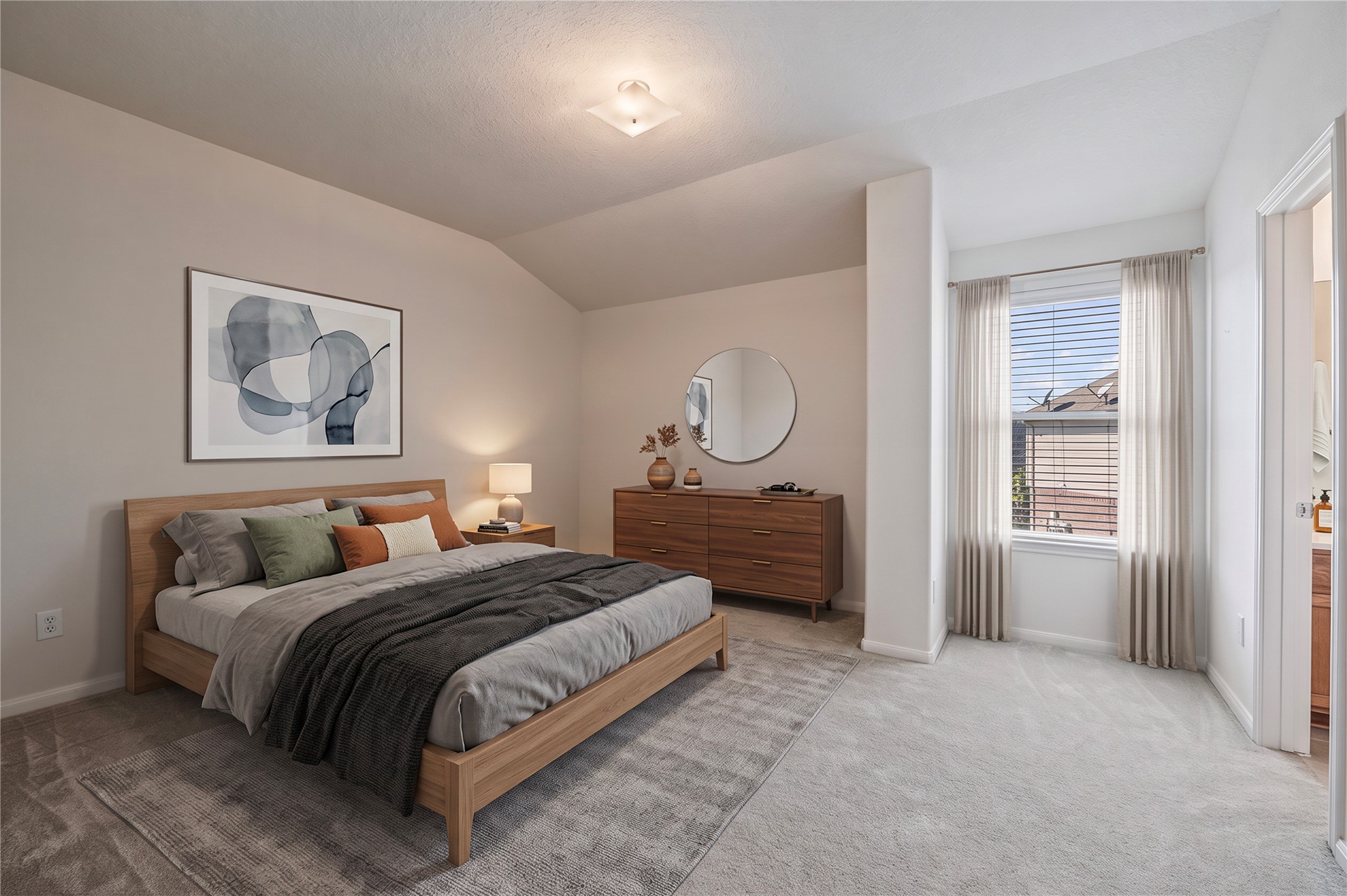 A roomy secondary bedroom upstairs with a walk-in closet and access to a shared full bath. Room is virtually staged.
