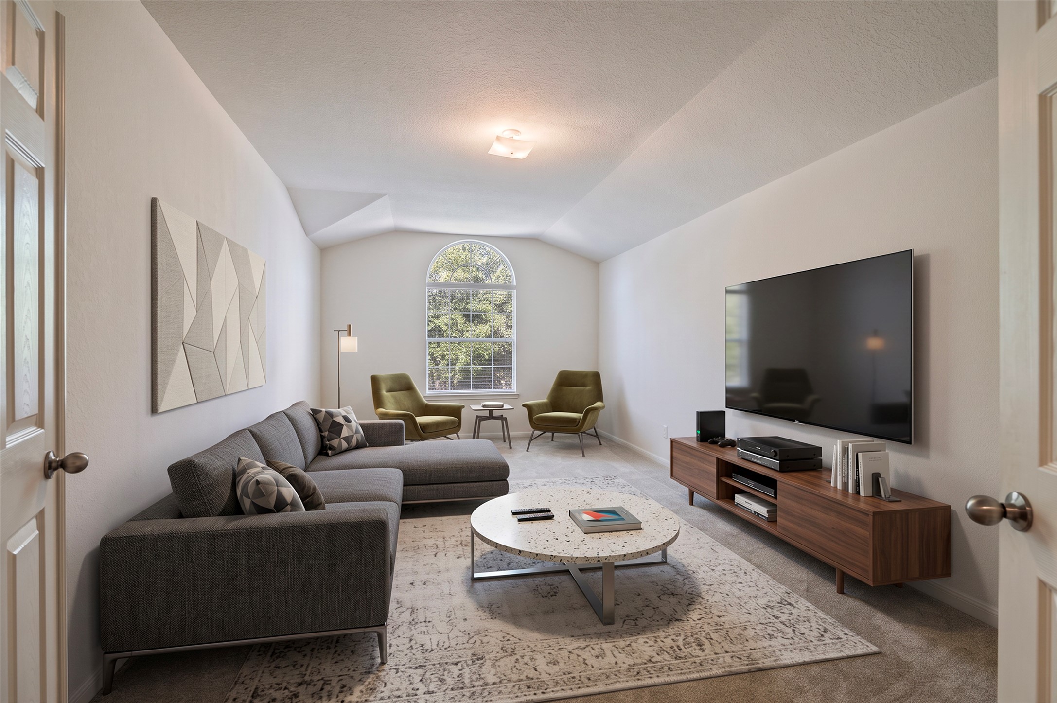 The spacious upstairs media room has double doors, ready for movie nights. Room is virtually staged.