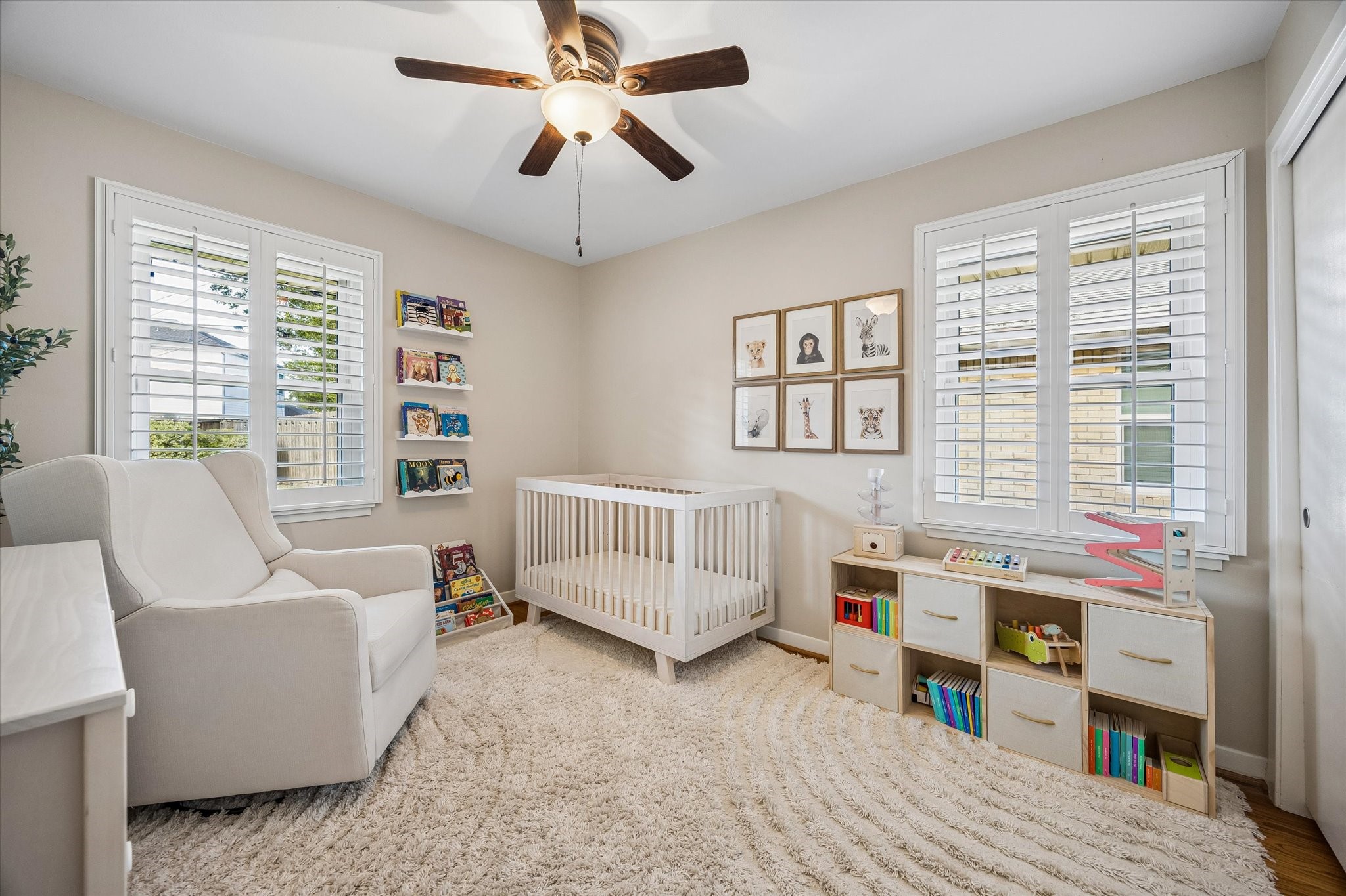 Natural light from windows on 2 walls brightens this bedroom. Its adaptable layout supports sleeping space, guests, work or hobbies, giving the home flexibility as needs change.