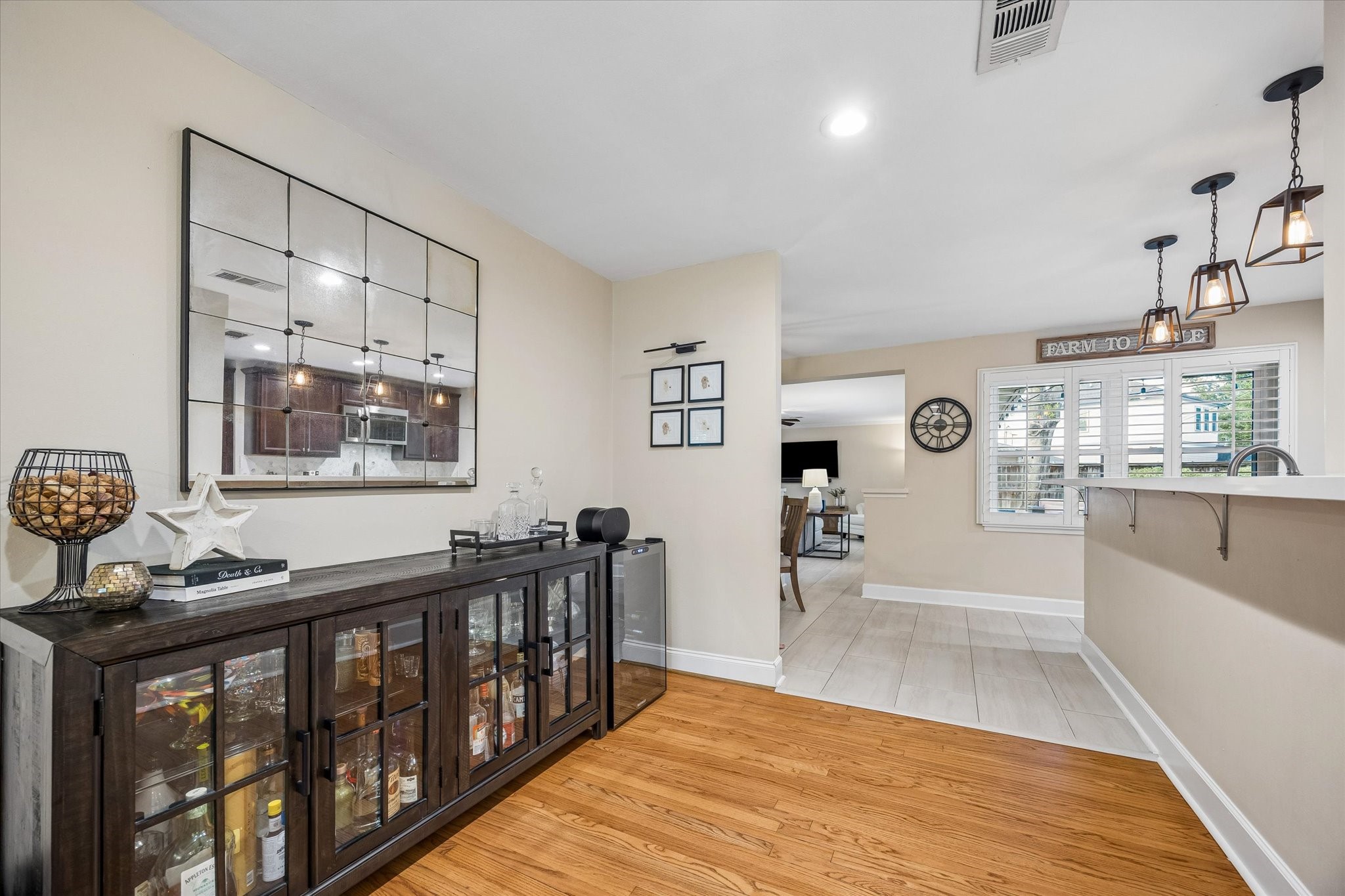 Direct access between the dining area and kitchen simplifies serving and cleanup. Open sightlines allow conversation to continue between the spaces, supporting the home's easy flow for daily routines and entertaining.