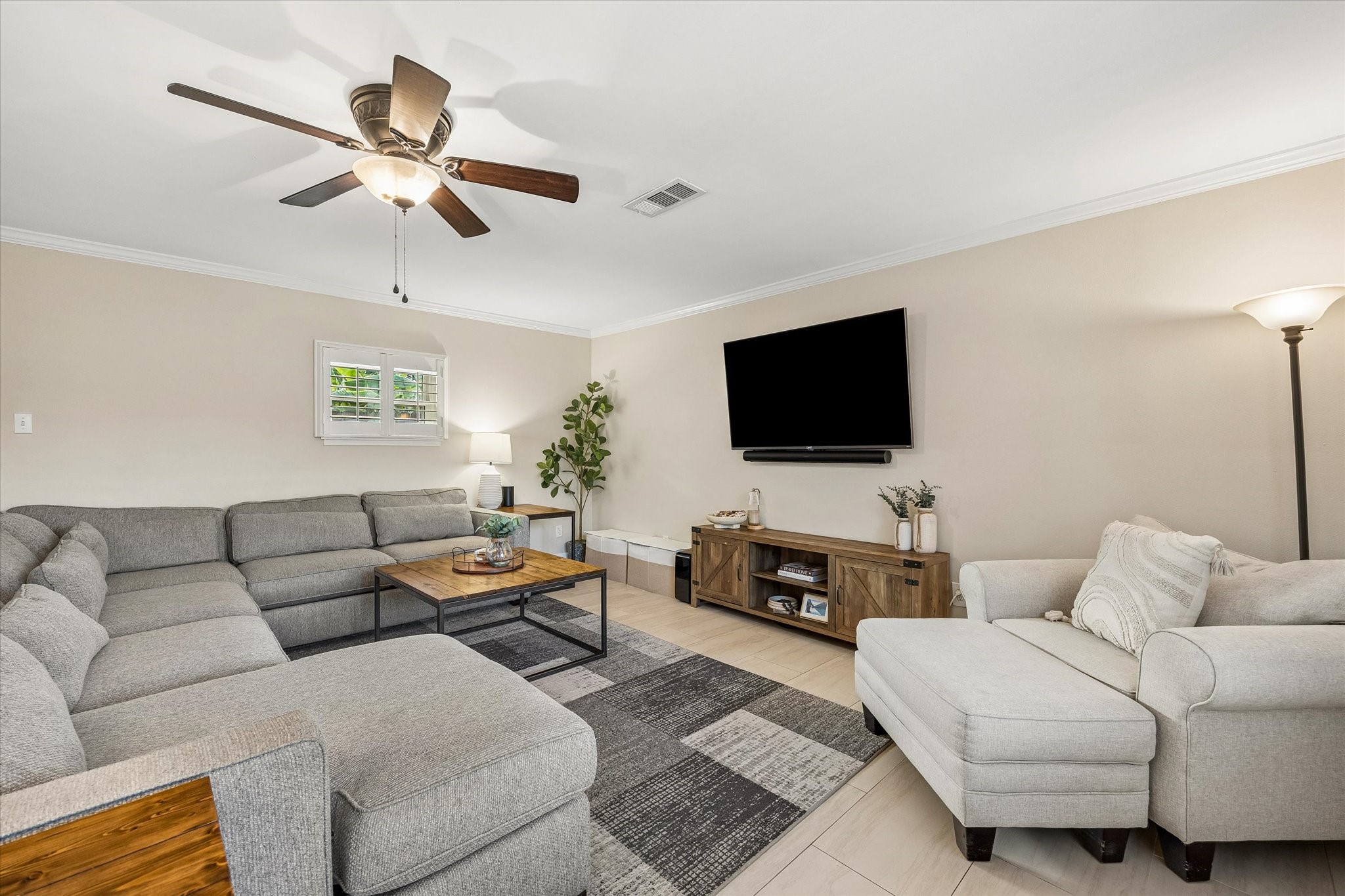 Spacious living room provides room to spread out, gather and relax. Its substantial footprint offers flexibility for multiple activities, while the nearby breakfast area and kitchen keep the main living spaces connected.