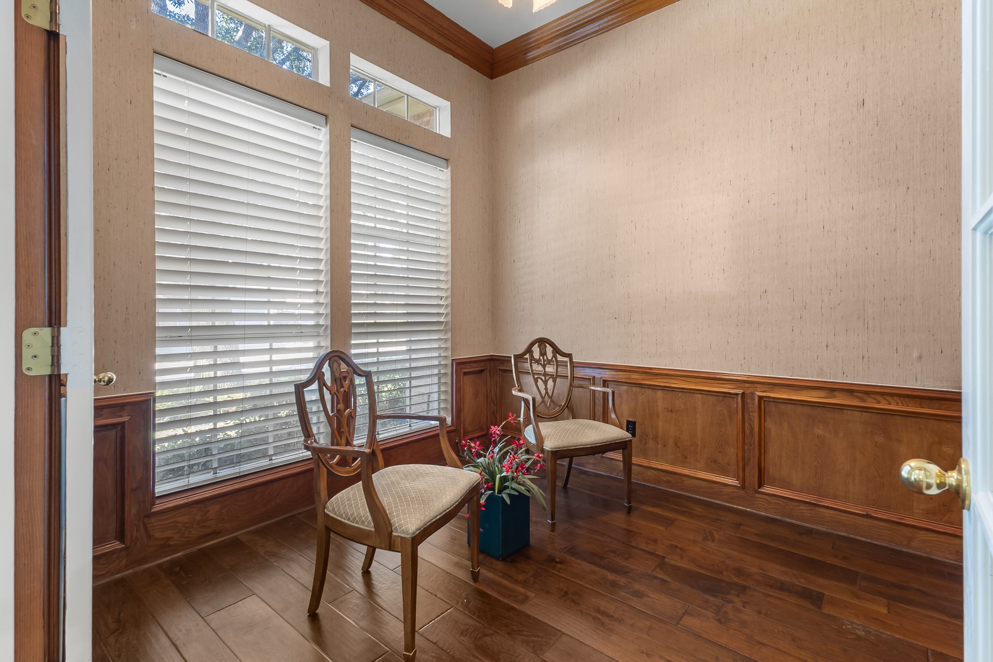 Rich wood paneling, substantial windows and classic detailing lend warmth and distinction to this dedicated study.