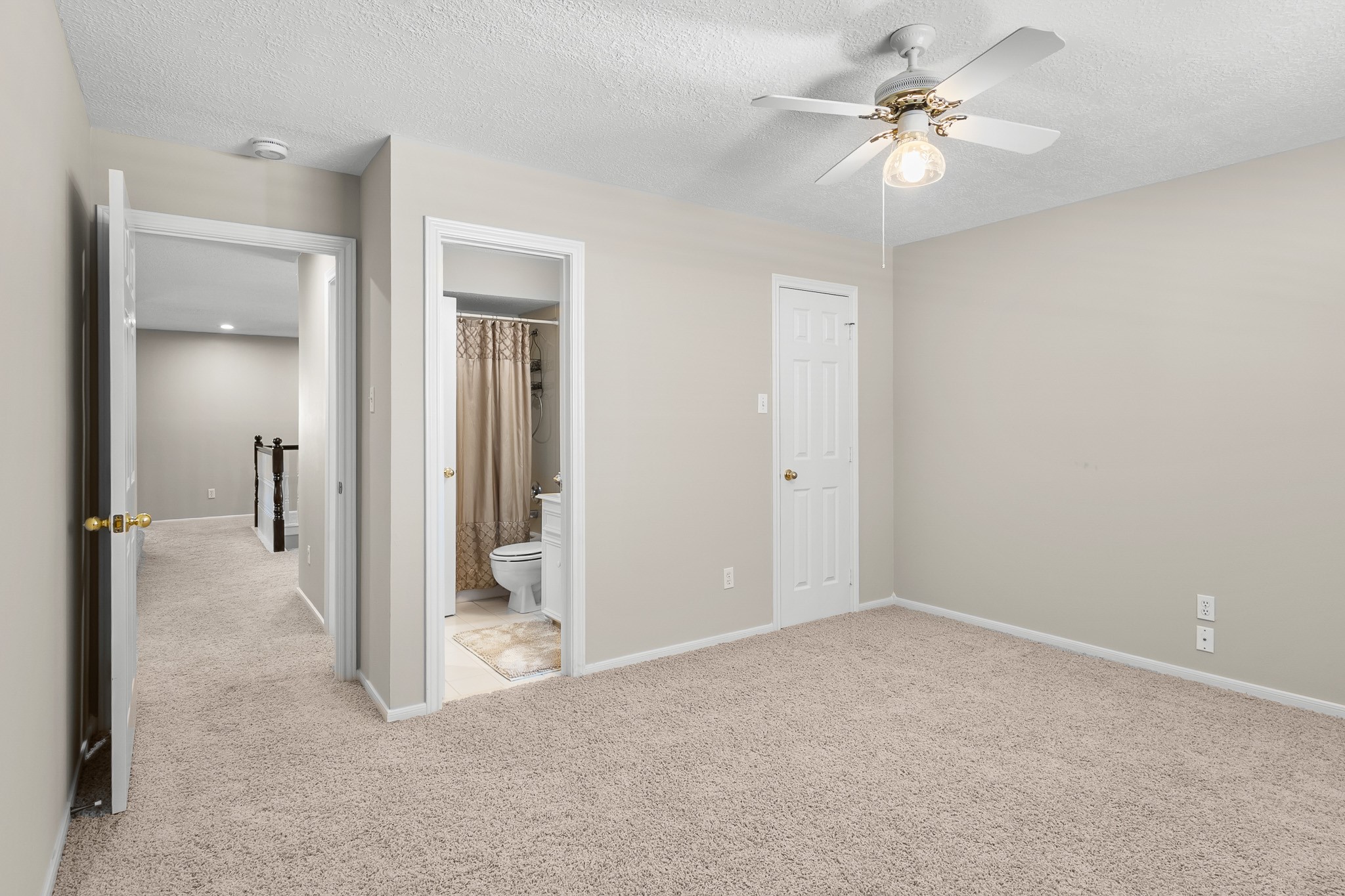A versatile bedroom layout offers convenient access to the adjoining bathroom and closet area.