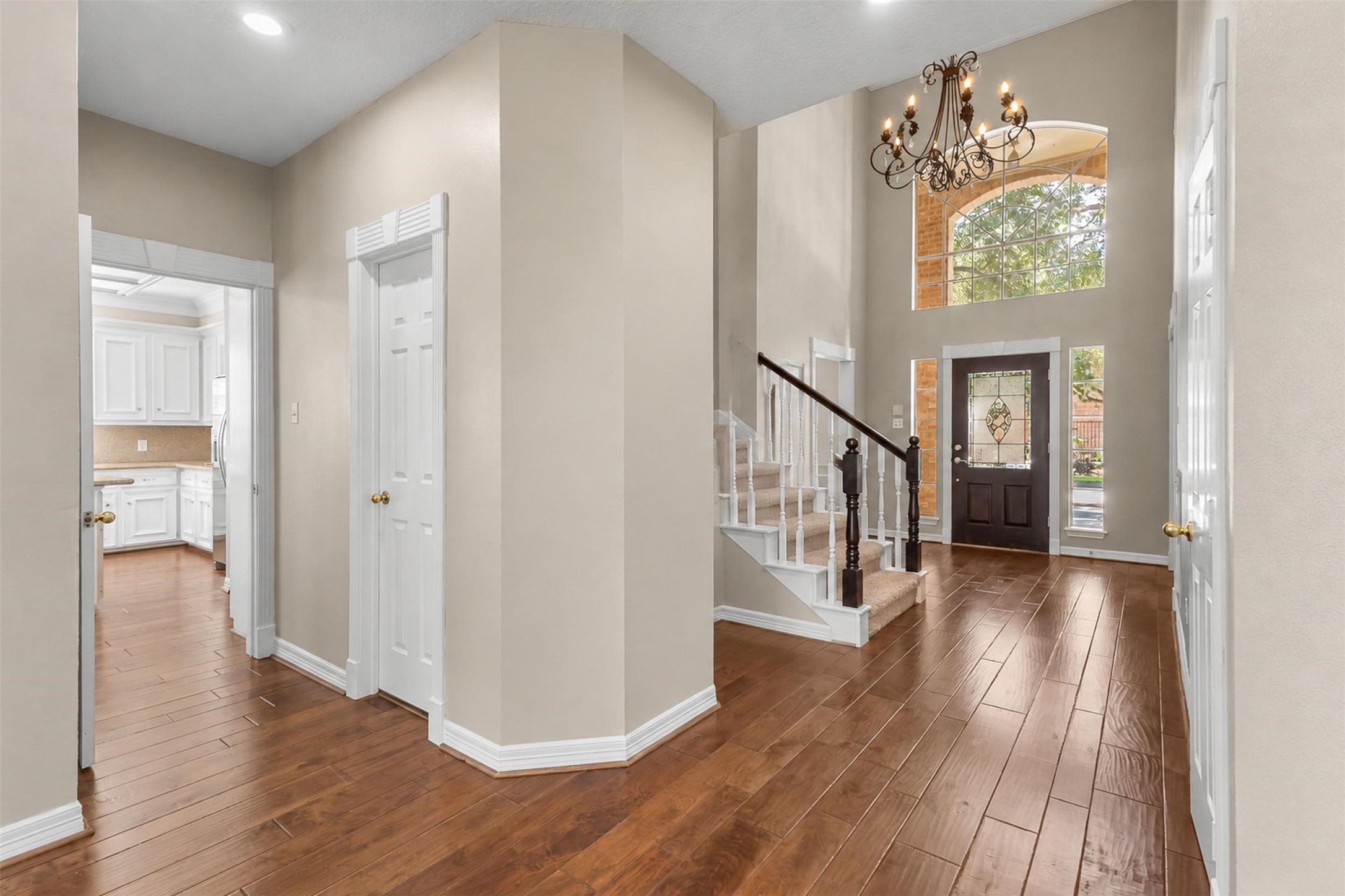 Step into a world of sophisticated elegance where a seamless, open-concept floor plan invites you to move effortlessly between living spaces, including the gourmet kitchen and custom detailed features throughout.