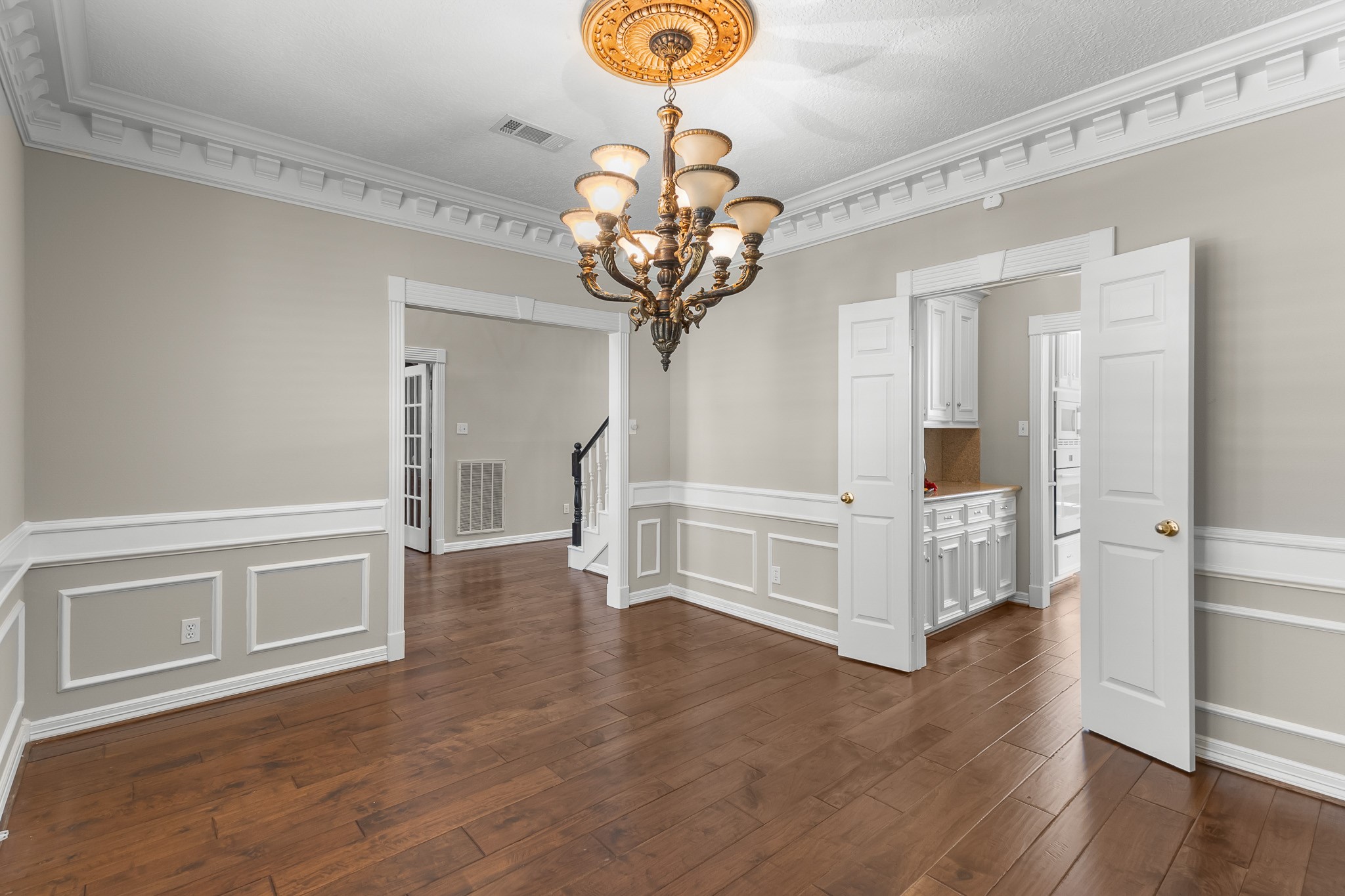 Beautifully proportioned and finished with elegant millwork, the formal dining room offers a refined backdrop for entertaining.