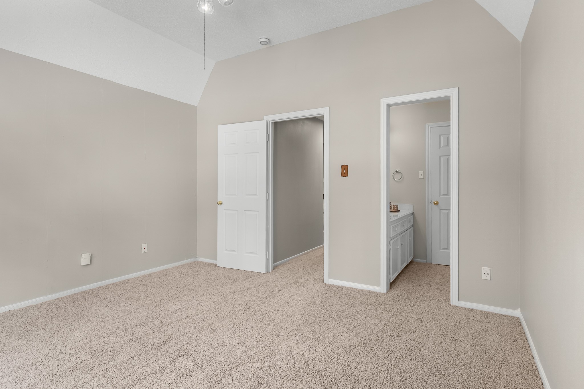 Generous floor space and a neutral palette offer a versatile setting for a bedroom, guest retreat or personal workspace.