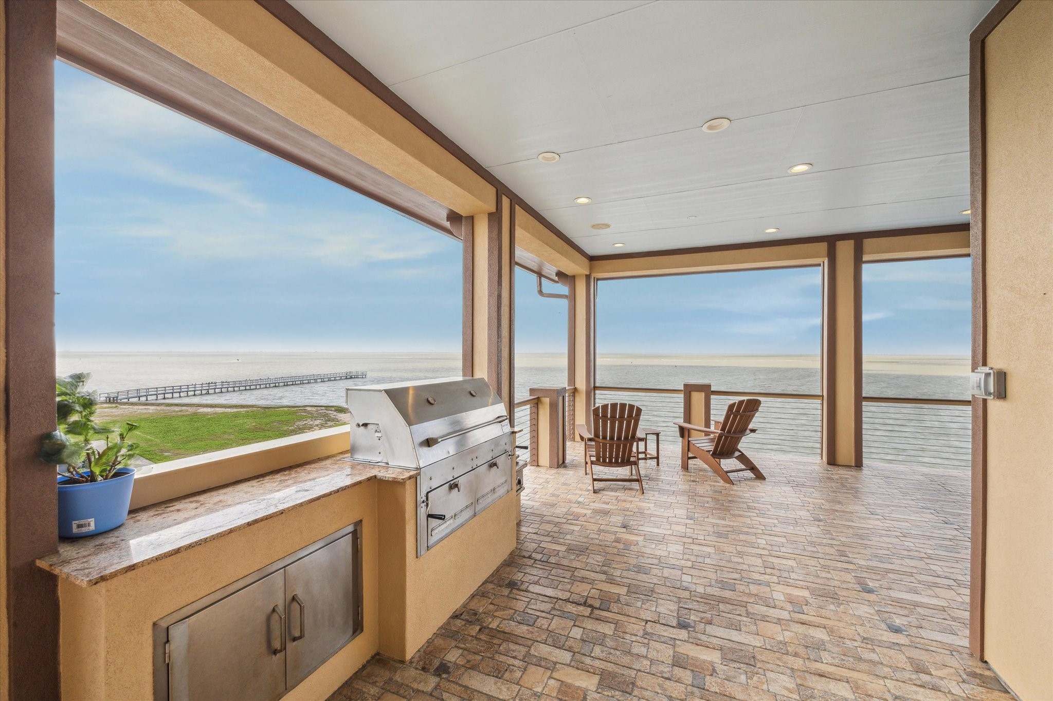 Summer kitchen on main living level includes a built-in Hasty-Bake
charcoal, double compartment barbeque pit with independent height
adjustable charcoal trays to control cooking temperature