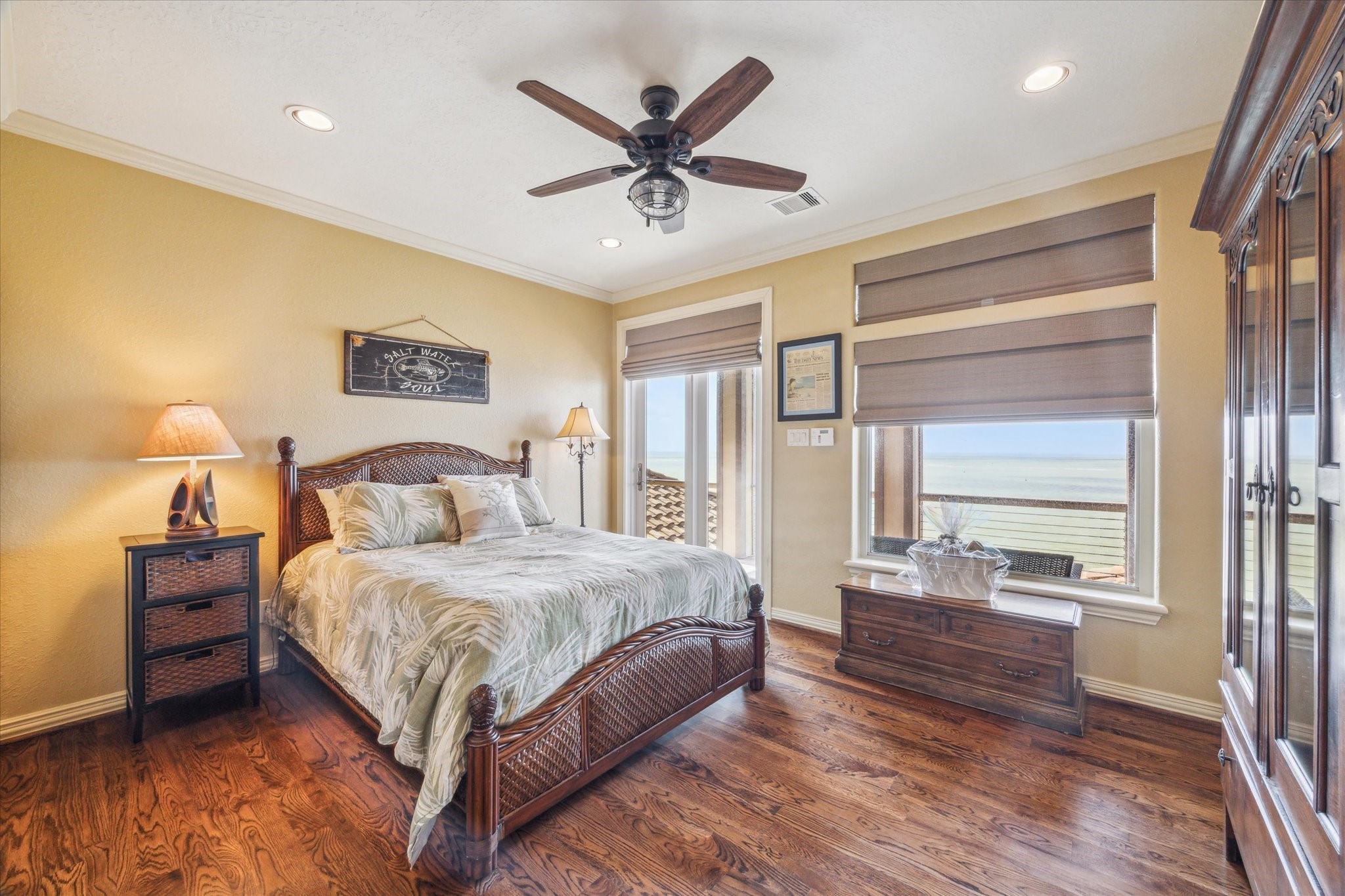 The upper level hosts three guest bedrooms, two of which open onto the upper balcony with stunning views overlooking West Galveston Bay. All bedroom closets offer built-ins with excellent storage