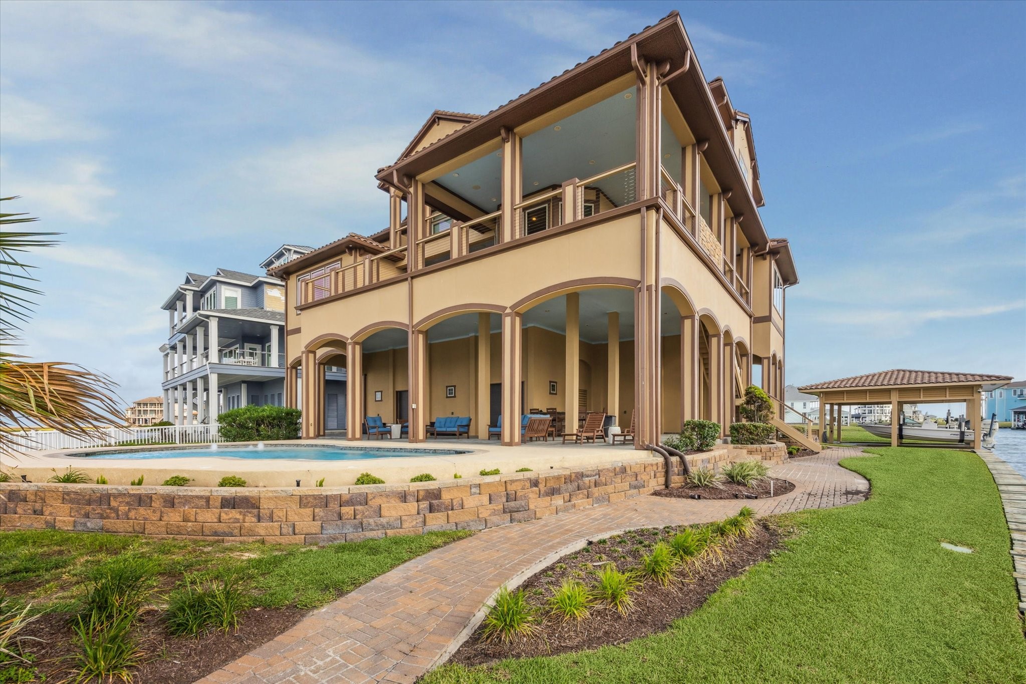 Fully engineered foundation anchored by 53 20-foot marine sub-pilings
driven 20 feet deep in soil; each attached at top to 3X 3 X 3 poured
concrete chair (4 X 4 X 4 at house midline); each over which is a
12 X 12 poured concrete column to height of 16 feet above the chair
level