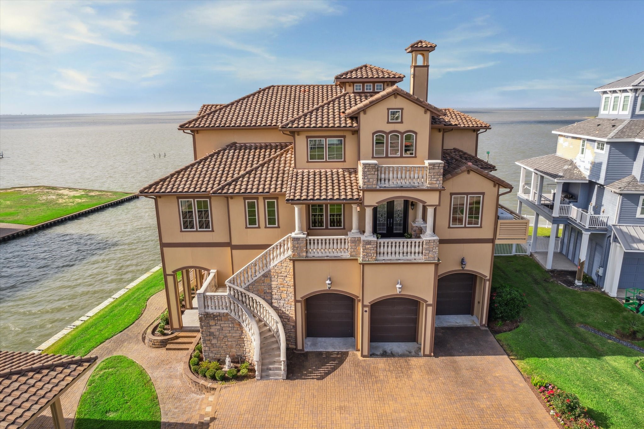 Welcome to 9 Happy Jack, Offering the VERY BEST views of West Galveston Bay with the ULTIMATE HOME CONSTRUCTION! Remote controlled hurricane shutter installed on front doors. Home exterior is made of Hardie plank covered by a textured acrylic
topping that is sculpted to make a veneer that resembles finished Stucco