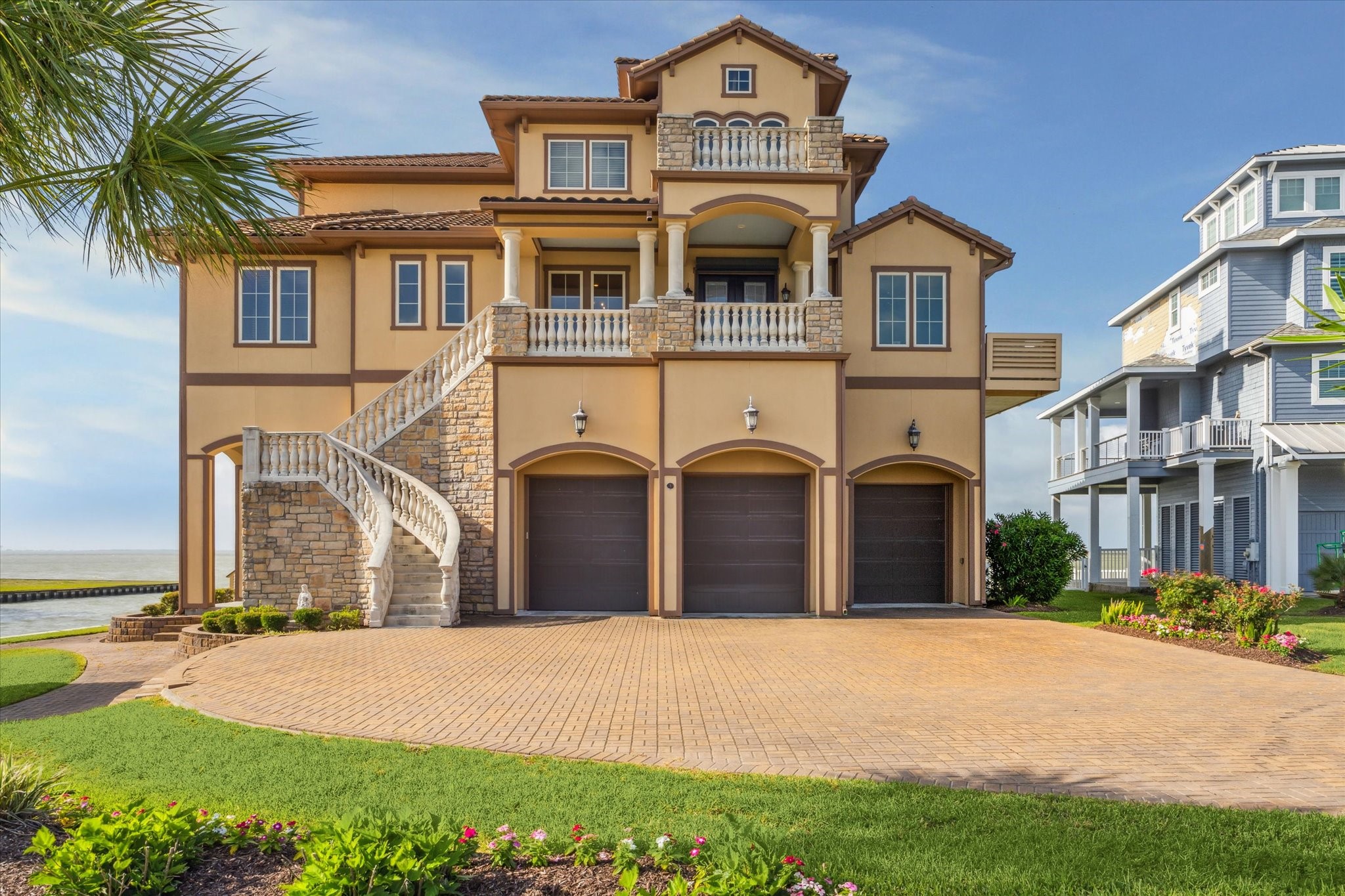 3 oversized 10 garage doors to access the driveway, plus 2 standard
8garage doors to the rear accessing the pool and bar area, to a fully
enclosed garage with sufficient space for any combination of up to 5 cars
or boat trailers, plus a golf cart area 3 oversized 10 garage doors to access the driveway, plus 2 standard
8garage doors to the rear accessing the pool and bar area, to a fully
enclosed garage with sufficient space for any combination of up to 5 cars
or boat trailers, plus a golf cart area
