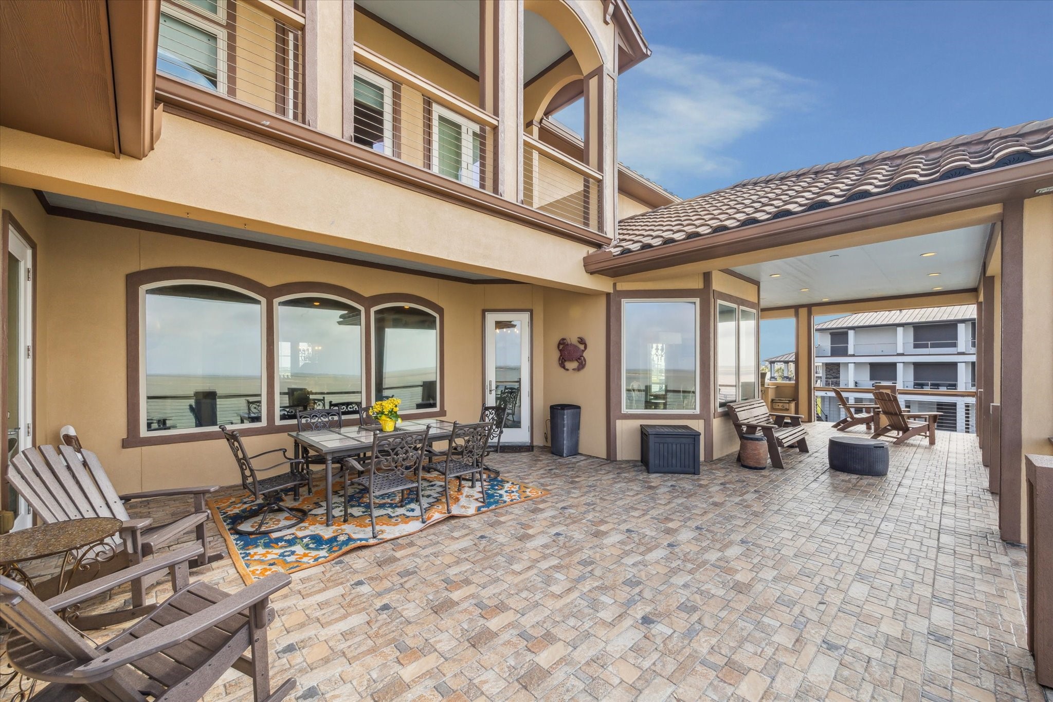 A generously sized main-level deck extends from the main living area, offering a relaxing space for outdoor entertaining and taking in the surrounding views