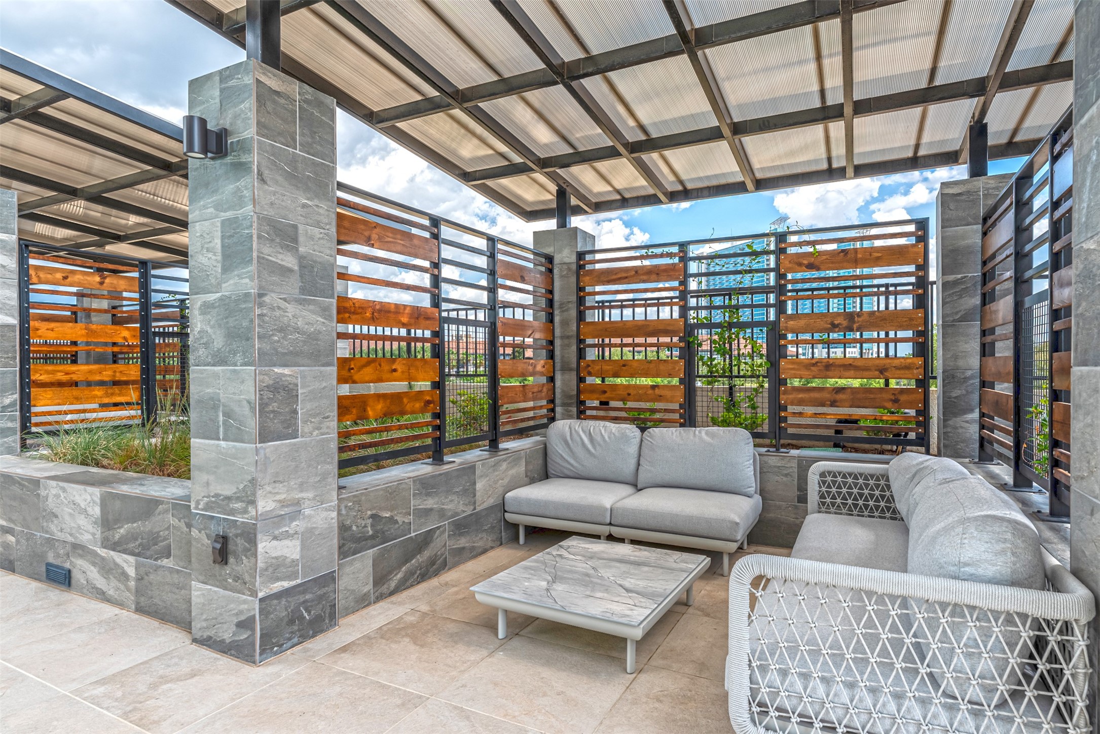 Comfy couches and greenery make this a splendid space to spend an afternoon.