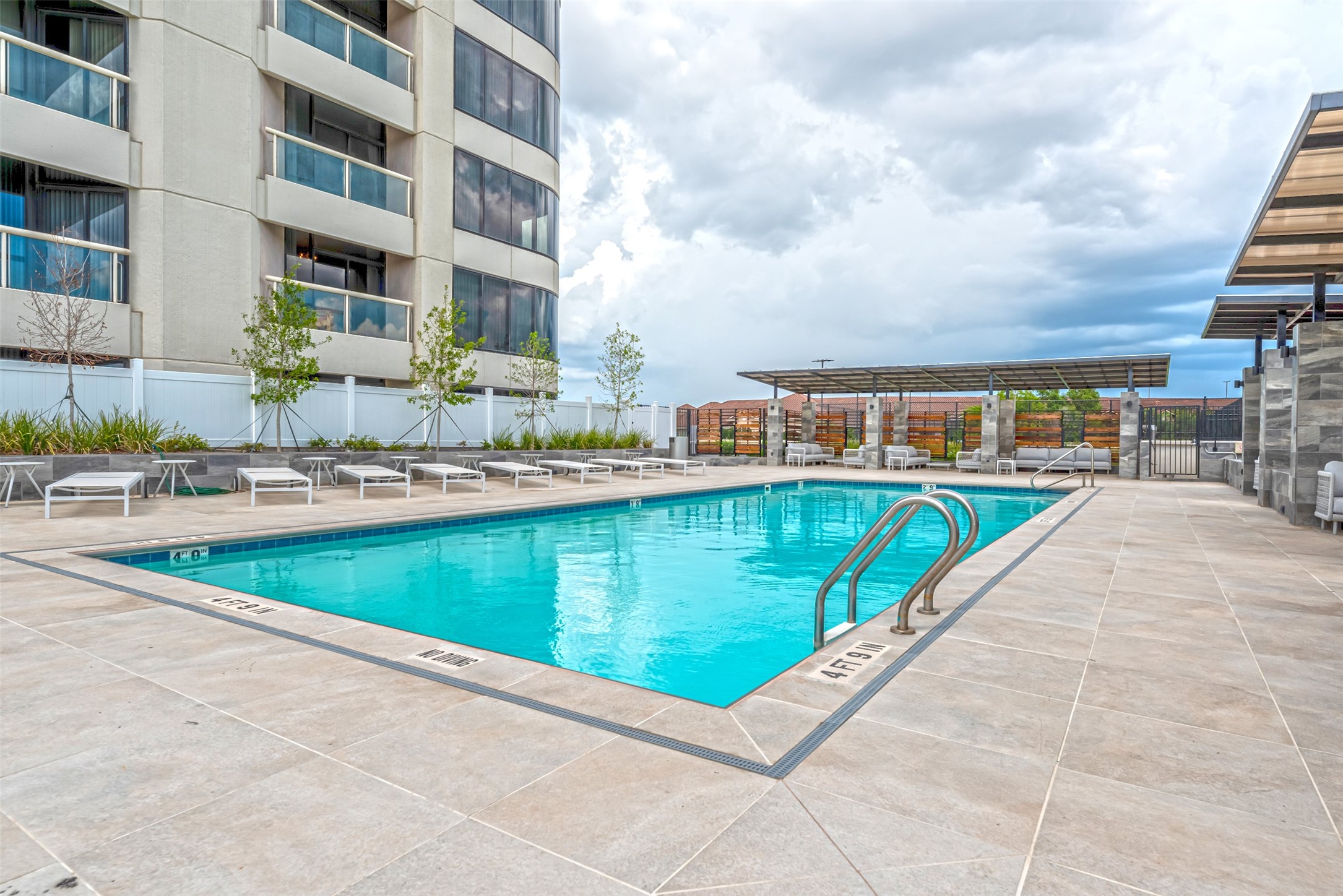 Amenity deck with resort-style pool has lovely treetop views from the third floor.
