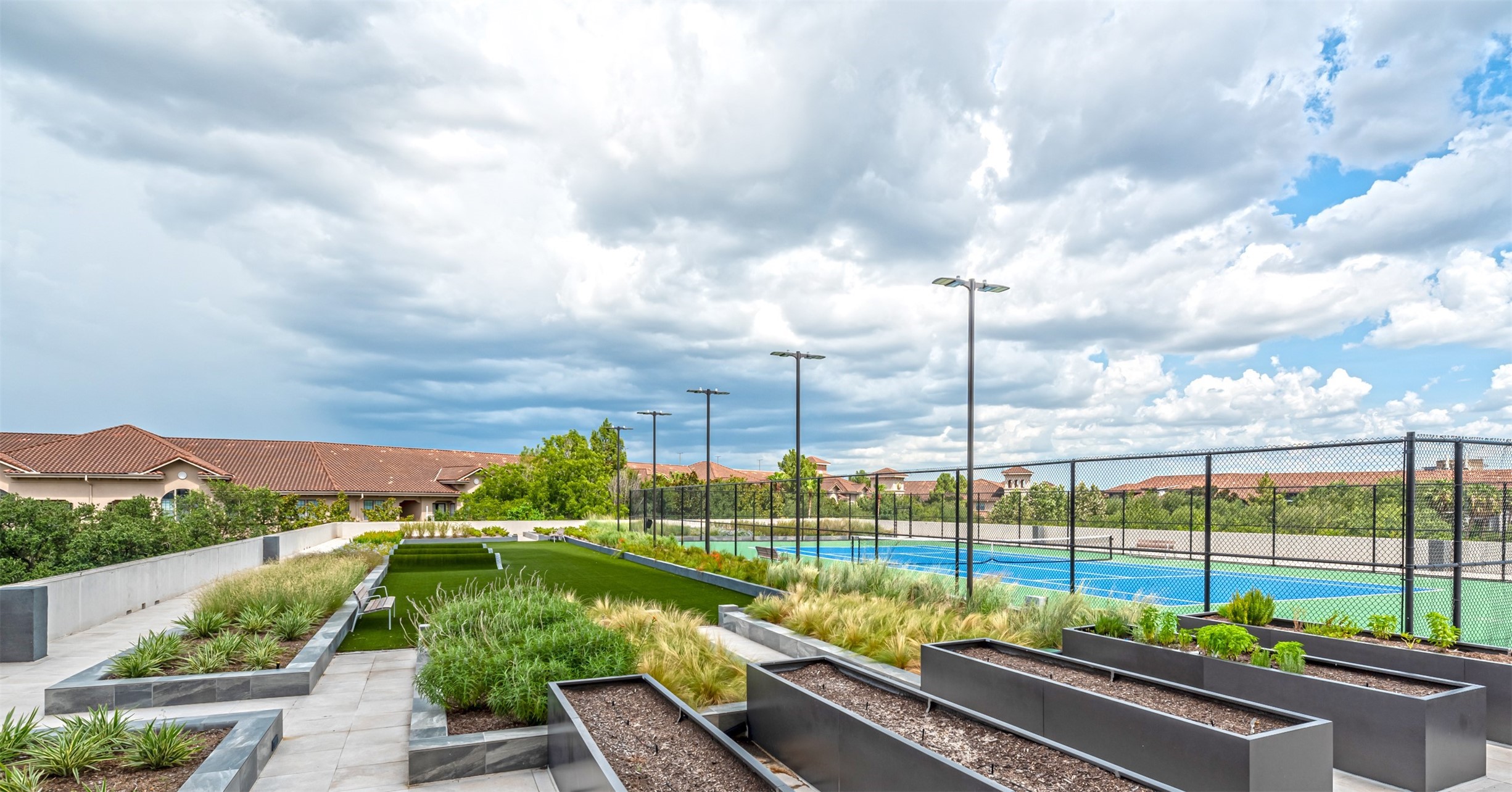 Third floor amenity deck is your own outdoor park with lit tennis courts, community garden and turfed fitness circuit.