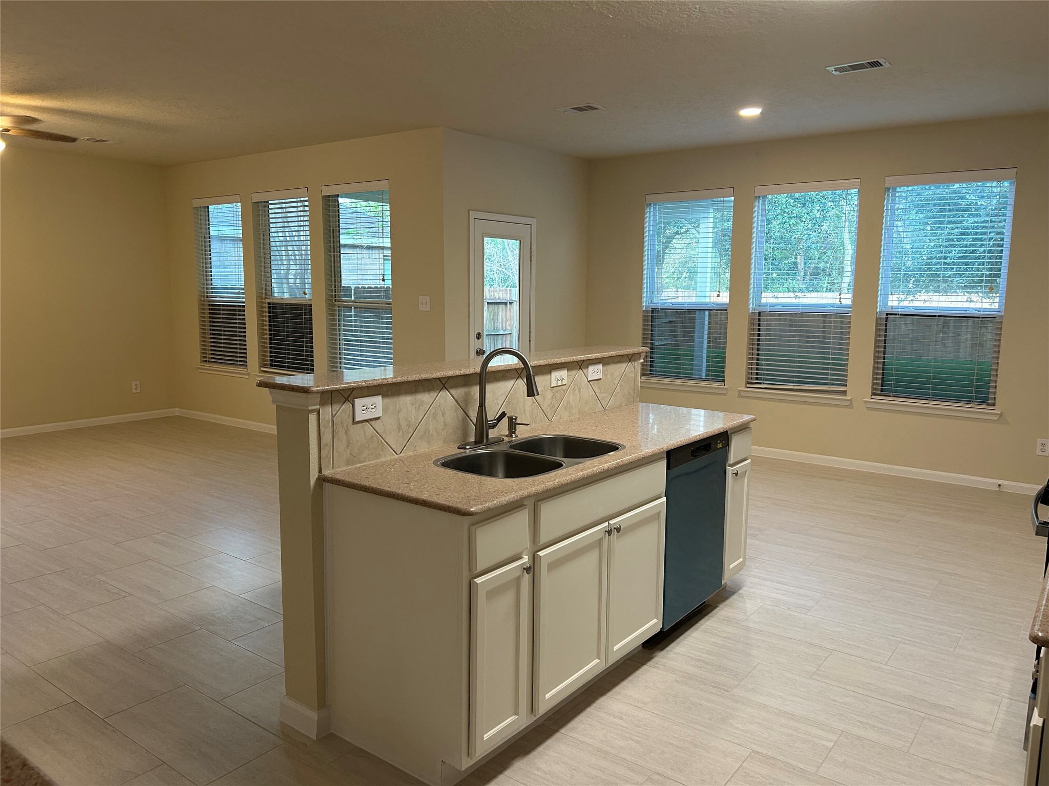 A view of the kitchen with easy access to the dining area as well as the family room.