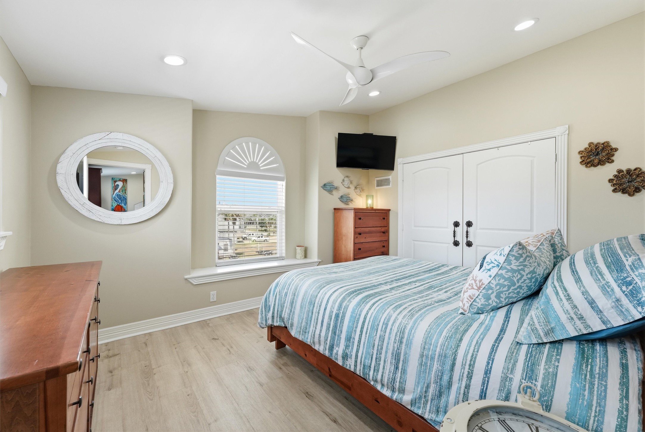 Comfortable secondary bedroom offers generous space, natural light, and ample closet storage.