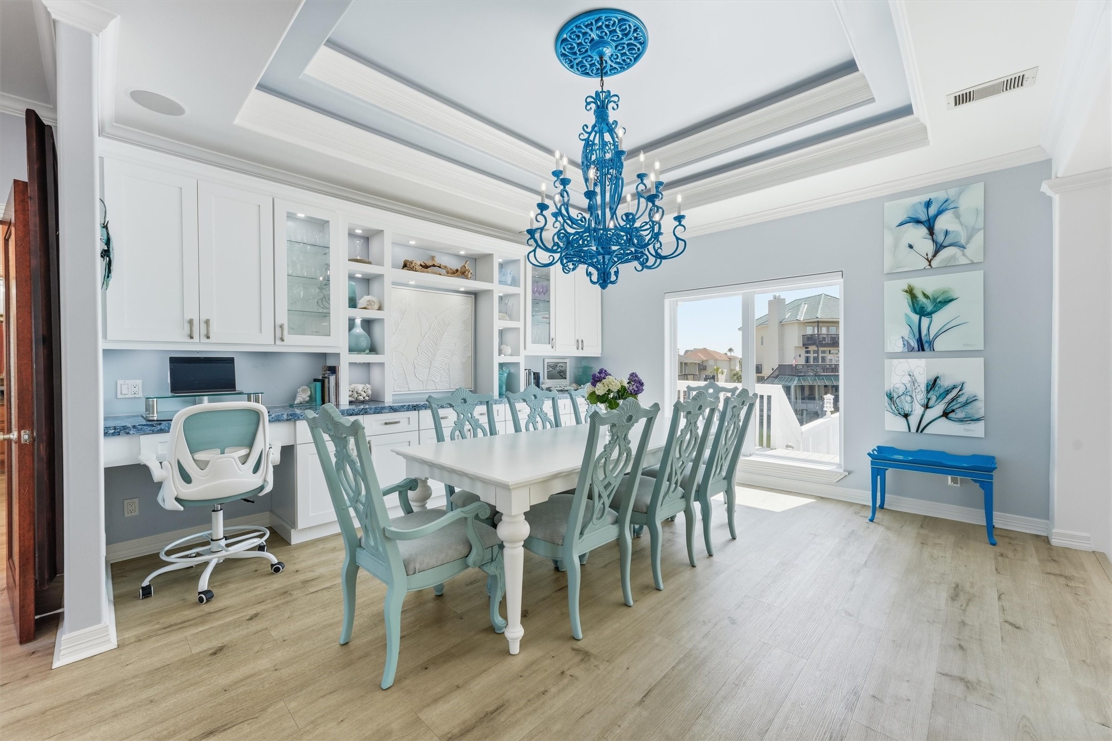 Spacious dining area with custom built-ins, detailed ceiling treatment, and plenty of room for gathering and entertaining. Spacious dining area with custom built-ins, detailed ceiling treatment, and plenty of room for gathering and entertaining.