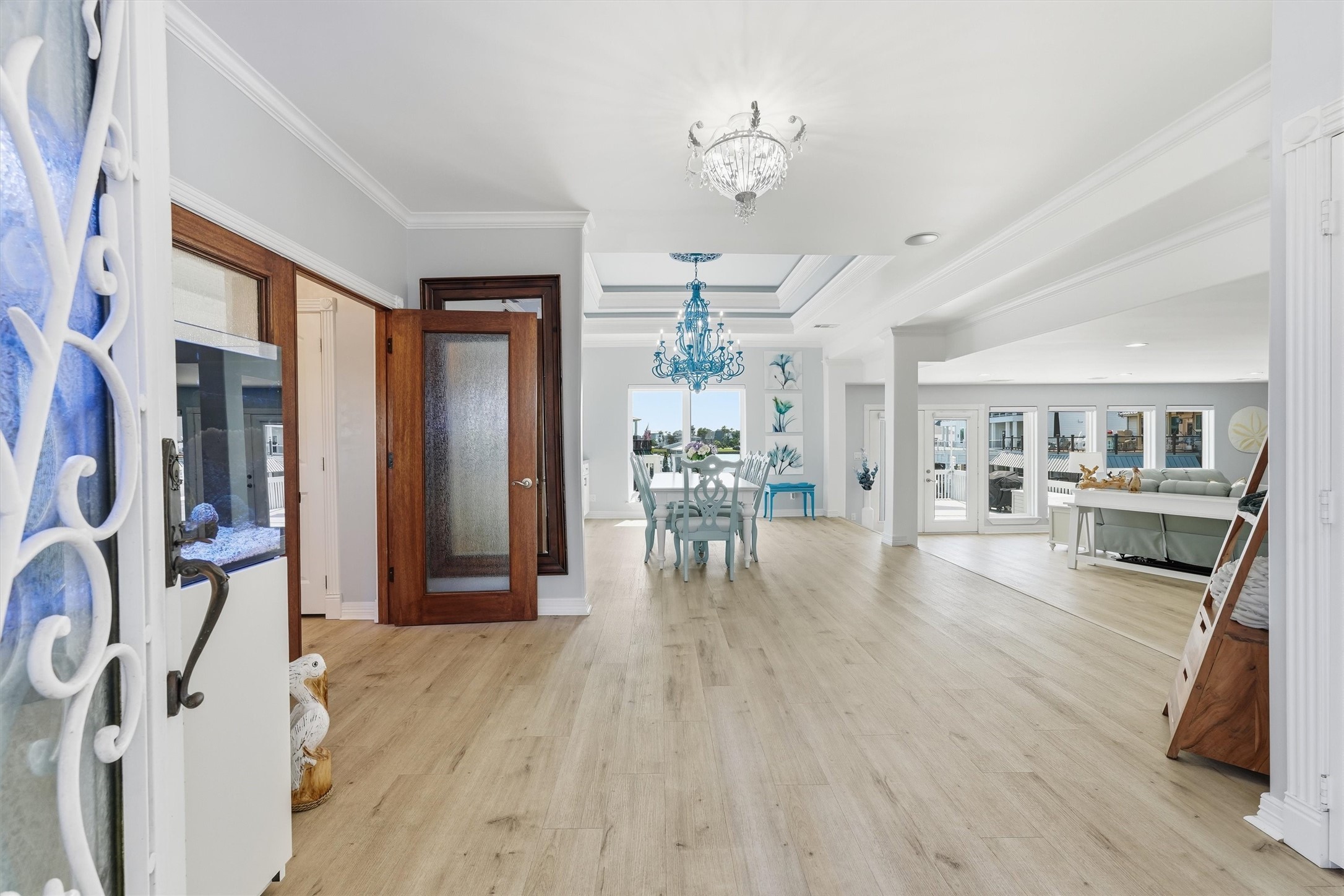 Step inside to a light-filled, open-concept layout designed to flow effortlessly toward the waterfront living spaces. Step inside to a light-filled, open-concept layout designed to flow effortlessly toward the waterfront living spaces.