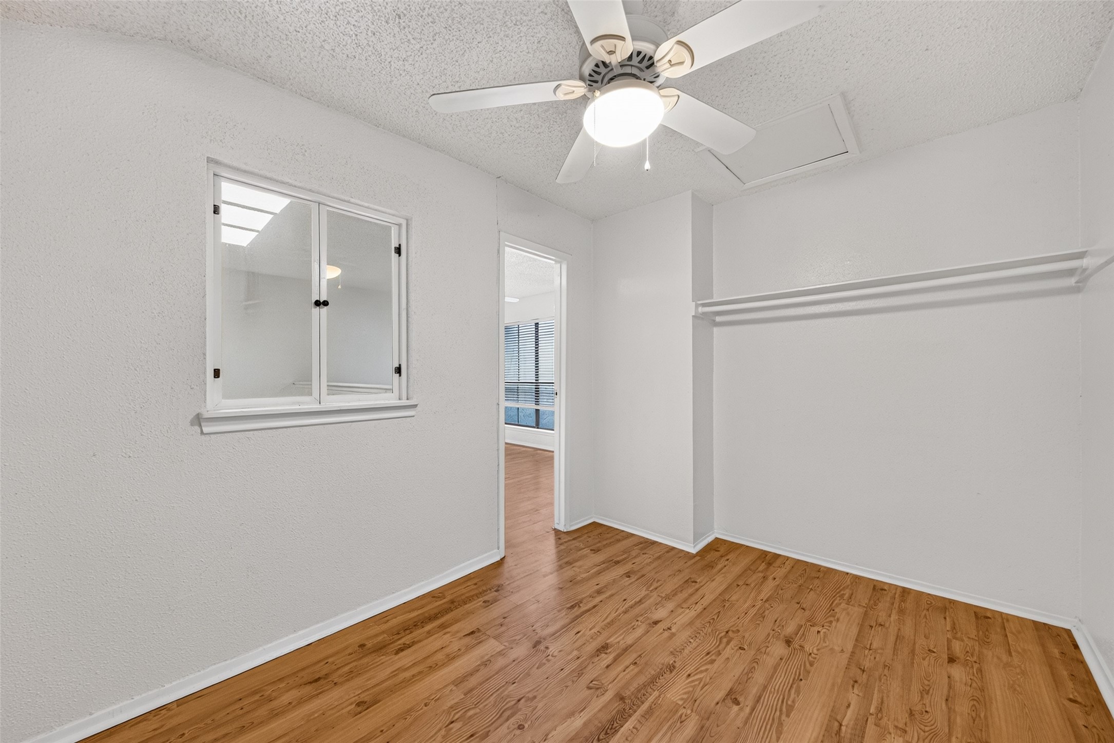 Another view of the flex room highlighting the interior window and convenient access to the adjoining hallway.