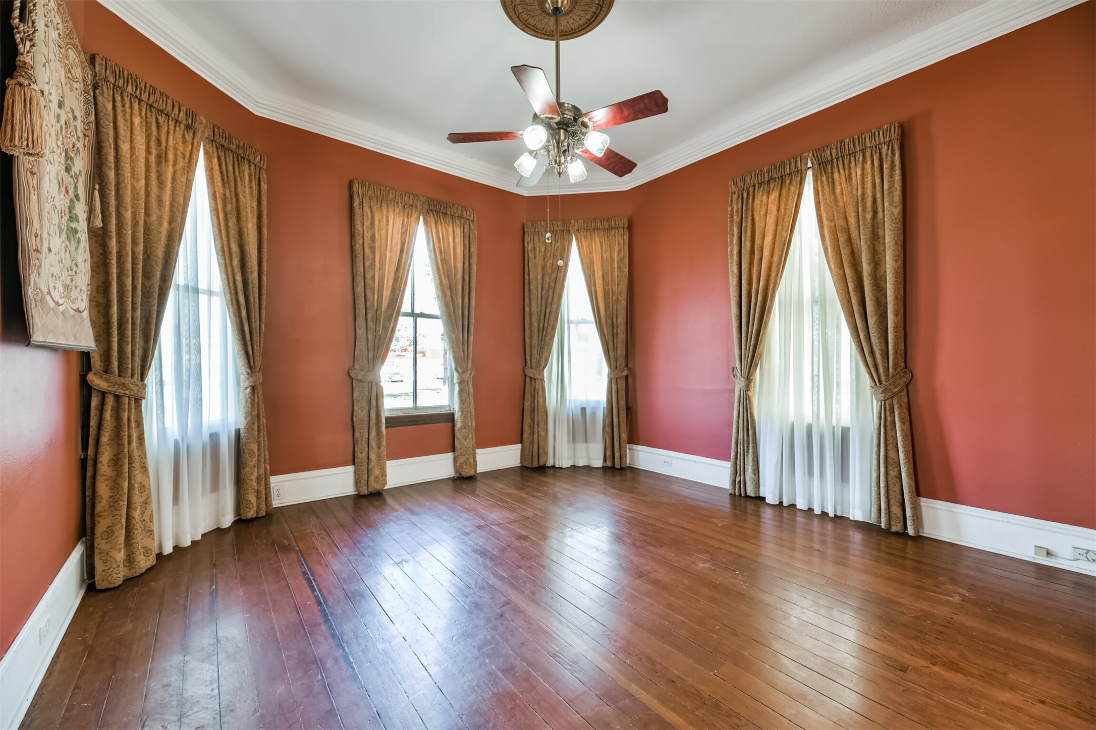 If walls could talk! Many significant conversations have surely transpired in this alcove of the living room that is bathed in sunlight streaming in through beautifully cased bay windows that overlook Broadway in the East End Historic District.