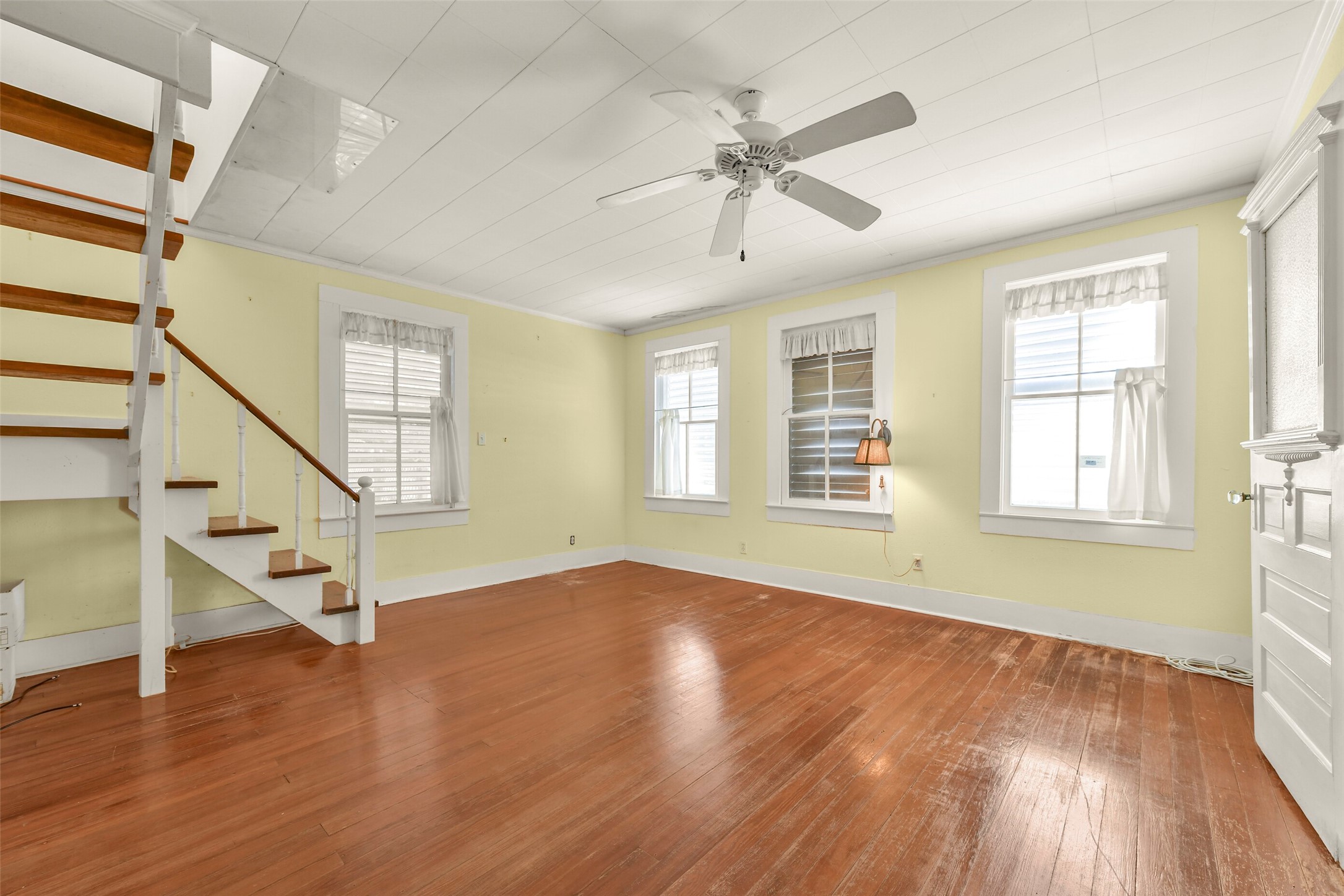 Bedroom showing stairs to loft