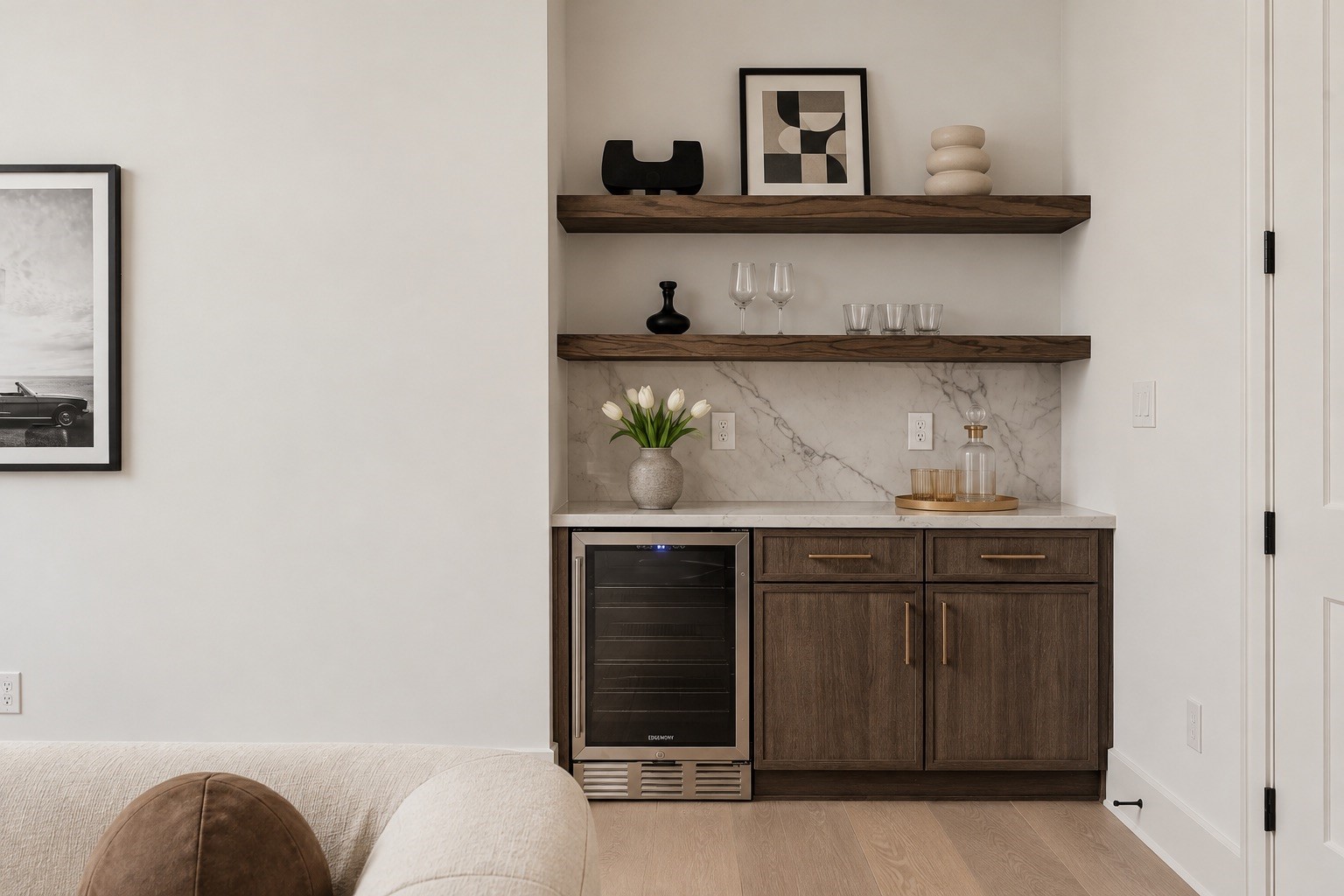 The game rooms custom dry bar is finished with Mount Blanc Quartzite, and a 24-inch beverage cooler, keeping refreshments conveniently within the upstairs entertaining space.