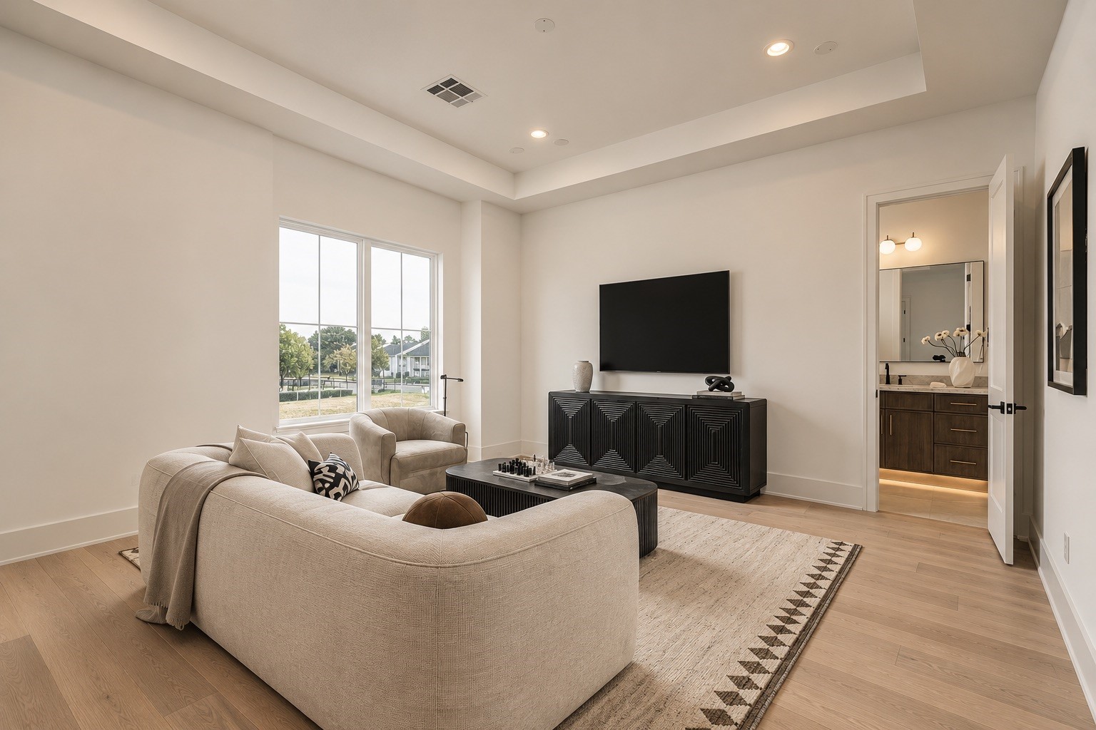 A second perspective highlights the game rooms generous scale and flexibility, offering ample space for movie nights, game days, or a relaxed secondary lounge.