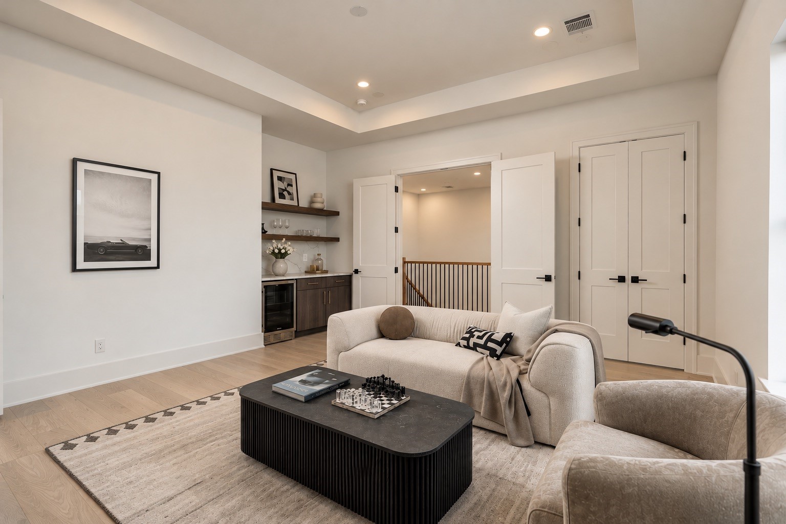 The dedicated game room creates a true second living space upstairs, complete with a custom dry bar, beverage cooler, dedicated storage, and pre-wiring for surround sound.