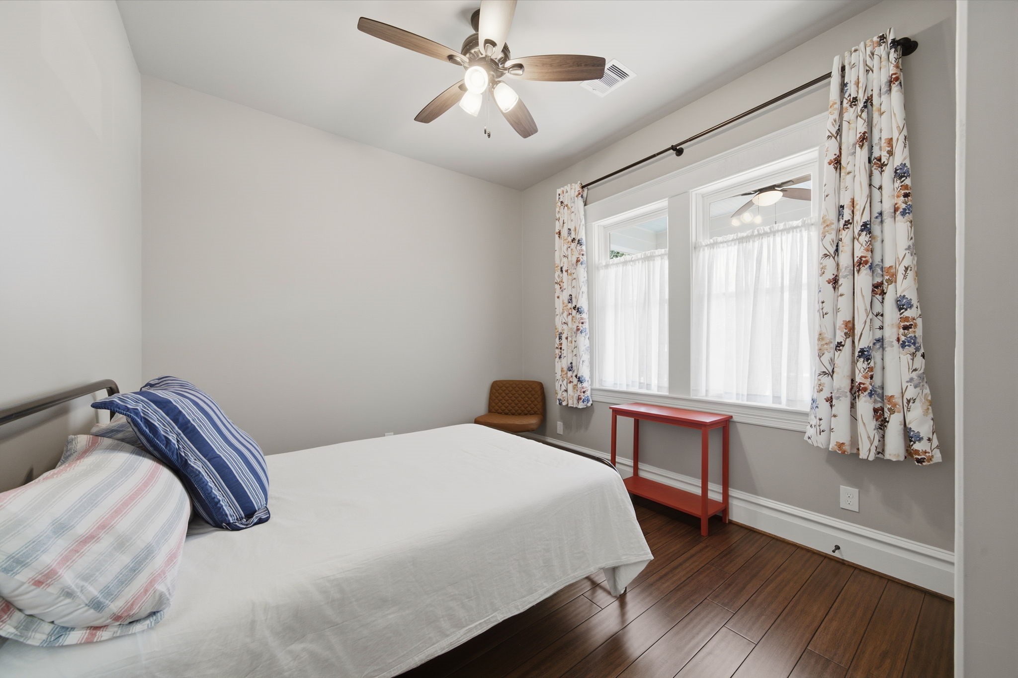 Guest bedroom (of 3) at the front of the home. Note the natural light pouring through! All window treatments stay with the home!