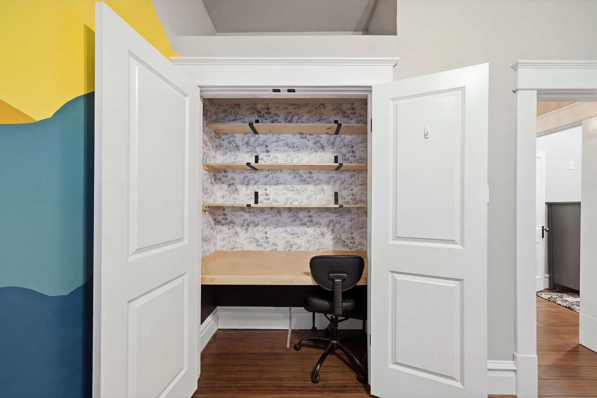 Double door closet has been converted into a craft space! Plenty of storage and room for your creative ideas!