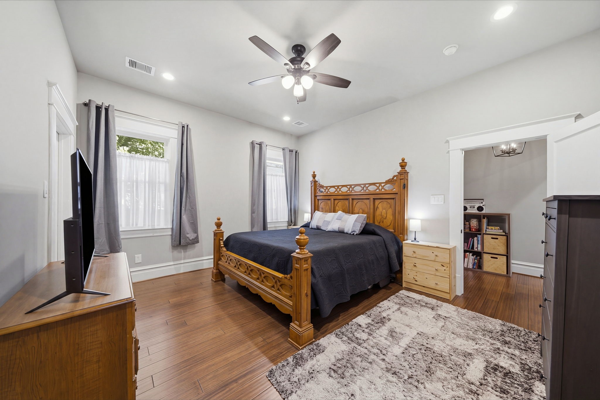 The generous-sized primary bedroom is off a vestibule near the kitchen. Attached primary bathroom and good sized walk-in closet makes for a peaceful retreat!