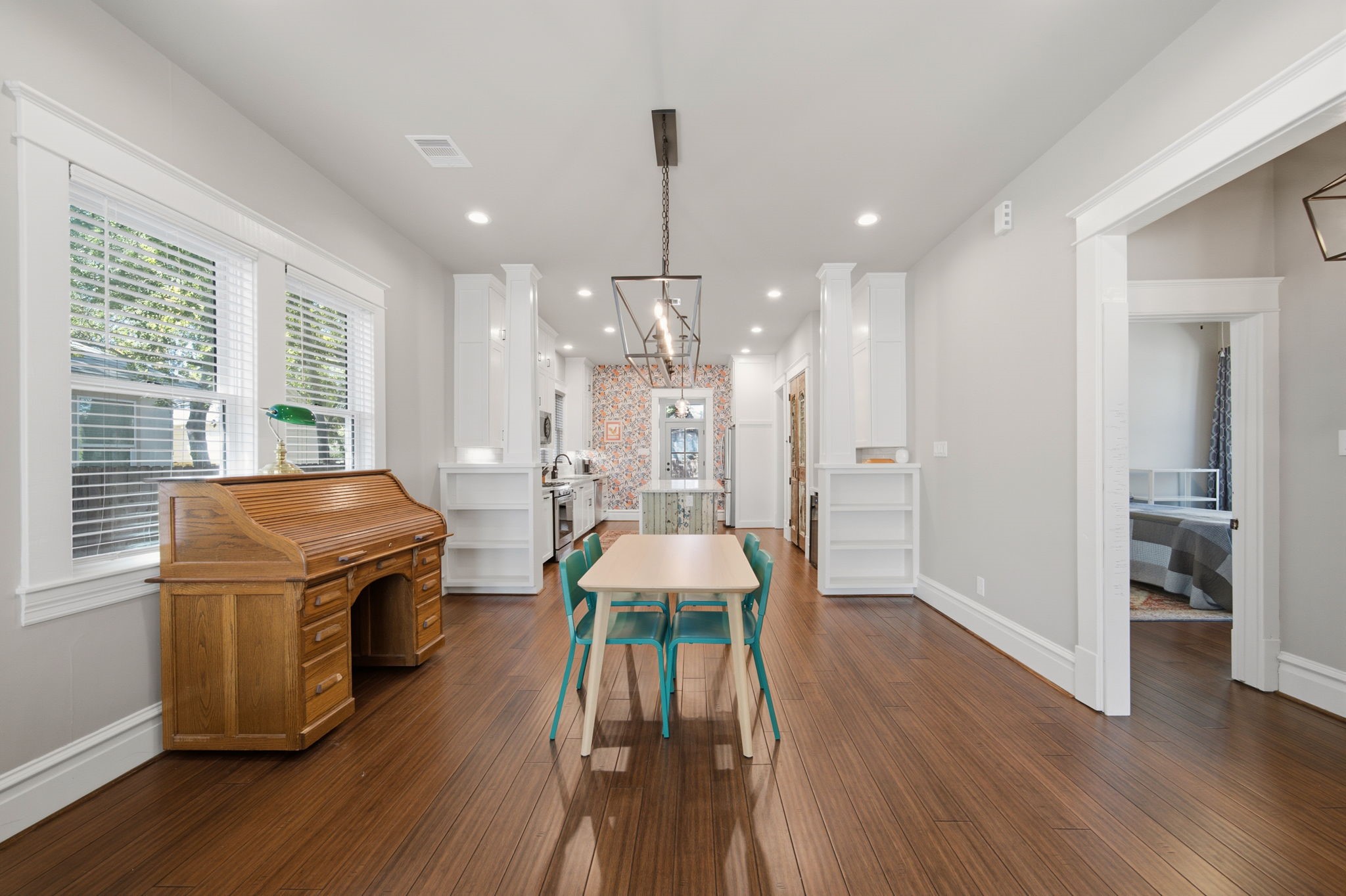 Note the connection between Living-Dining-Kitchen - great for entertaining!!! Craftsman-style columns and bookshelves divide the space between the Dining and Kitchen!