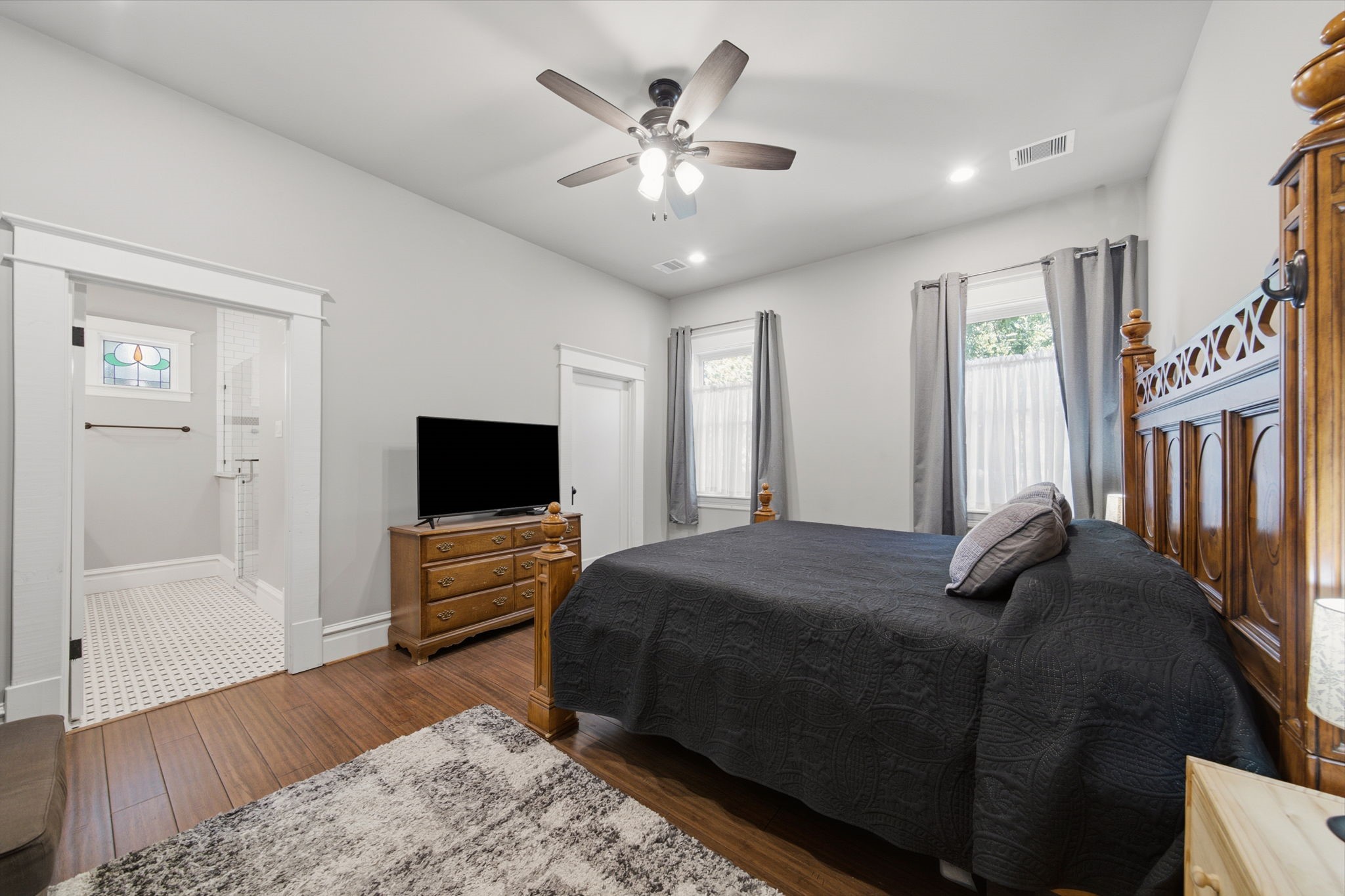 Another view of the primary bedroom and layout of the primary and good sized walk-in closet (on the right, door is closed)