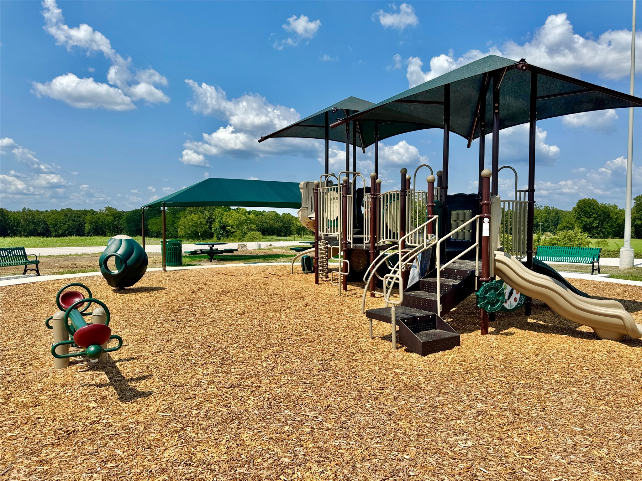 Enjoy outdoor fun and play at the community playground, which features slides, swings, and climbing equipment, plus a covered area with tables for picnics and gatherings.