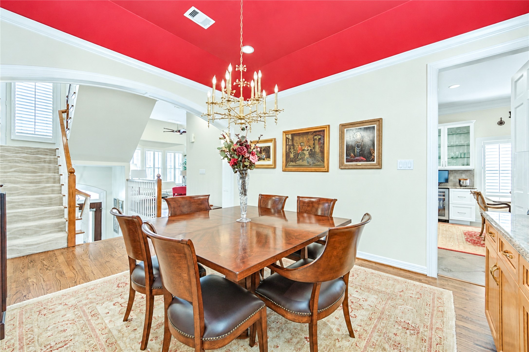 The elegant formal dining room features hardwood floors, refined crown molding and an arched opening, creating a lovely setting for entertaining. The elegant formal dining room features hardwood floors, refined crown molding and an arched opening, creating a lovely setting for entertaining.
